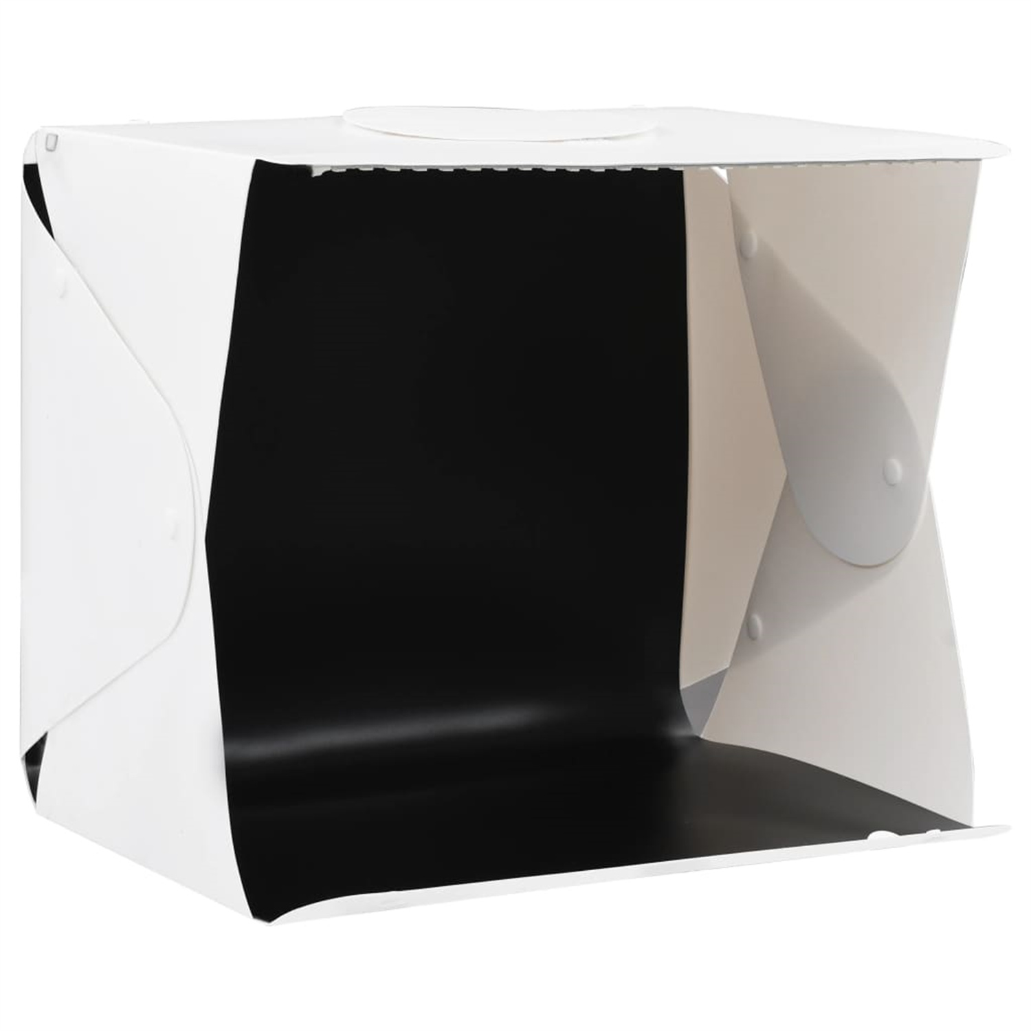 Eine weiße Fotostudiobox mit schwarzem Hintergrund. Sie wird von oben beleuchtet.