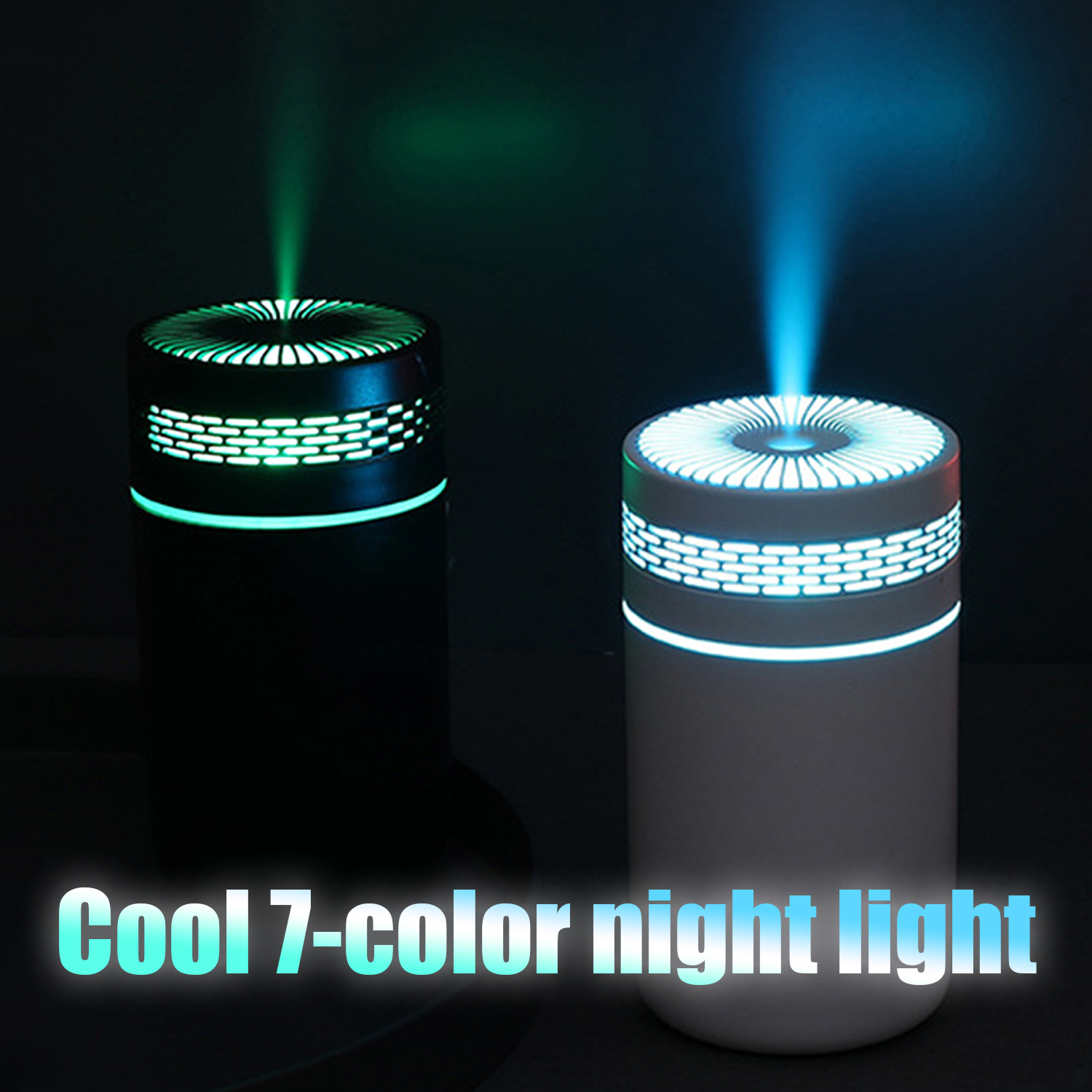 Dwa małe, czarno-białe, cylindryczne nawilżacze. Jeden ma zielone światło, drugi niebieskie.