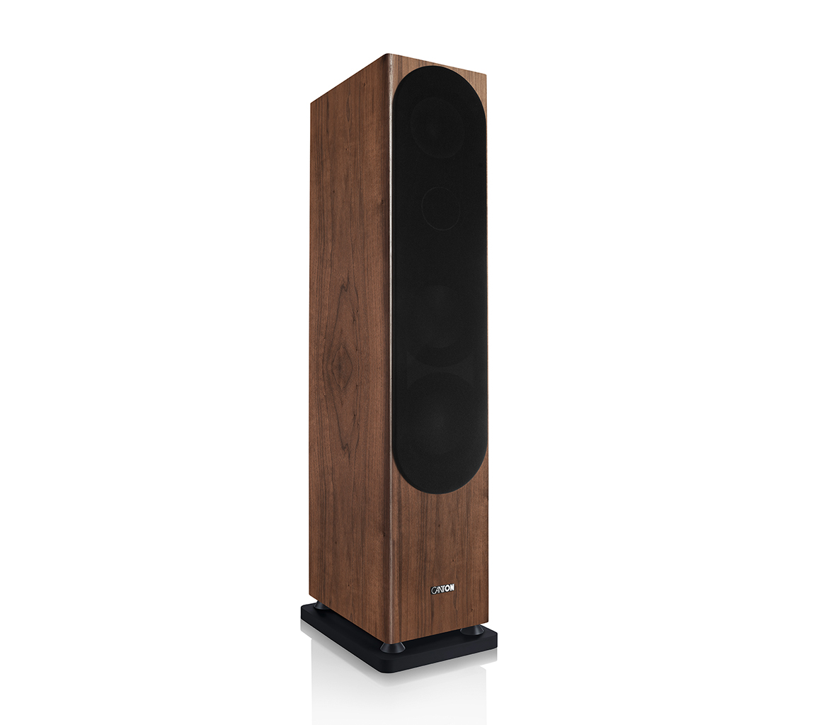 Ein hoher Lautsprecher aus Holz mit schwarzer Frontplatte und schwarzem Sockel.