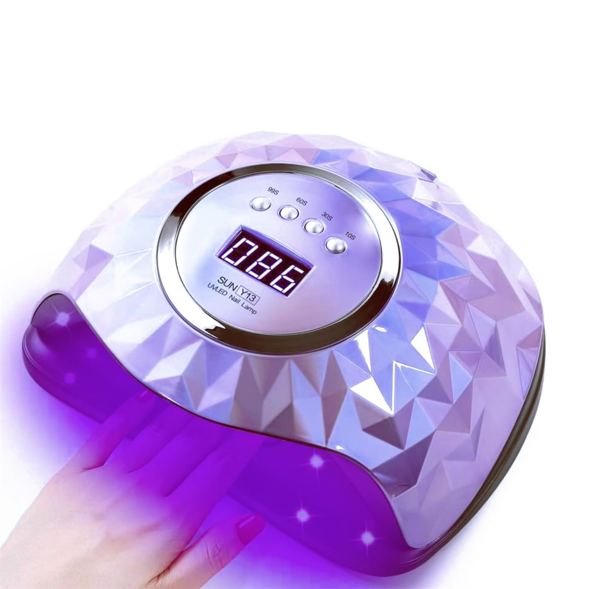 Eine Nagellampe mit einer Hand darunter. Sie ist lila mit weißen Akzenten und digitaler Anzeige.