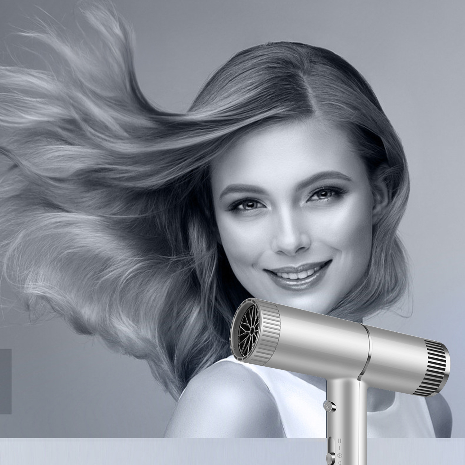 Donna con capelli fluenti che usa un asciugacapelli argentato. I capelli sono castano chiaro.