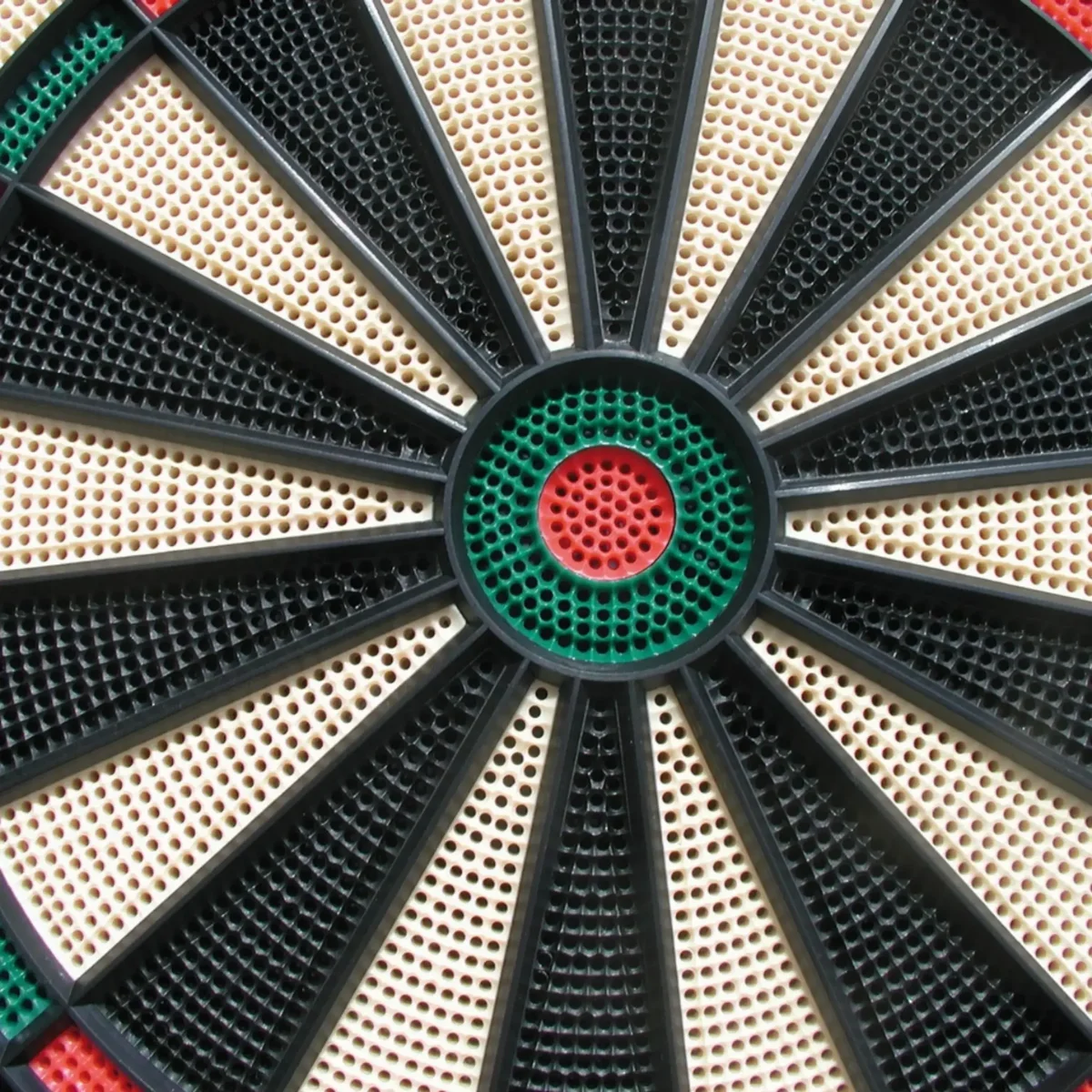 Close-up of a dartboard, black, beige, green, red, and white.