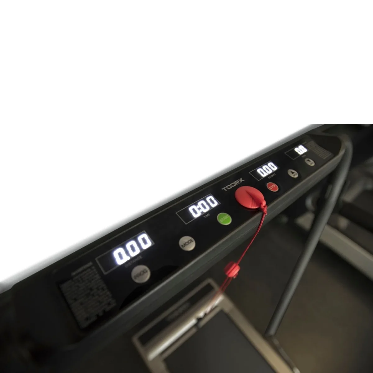Close-up of a treadmill's control panel. Displays time, speed, and mode settings.