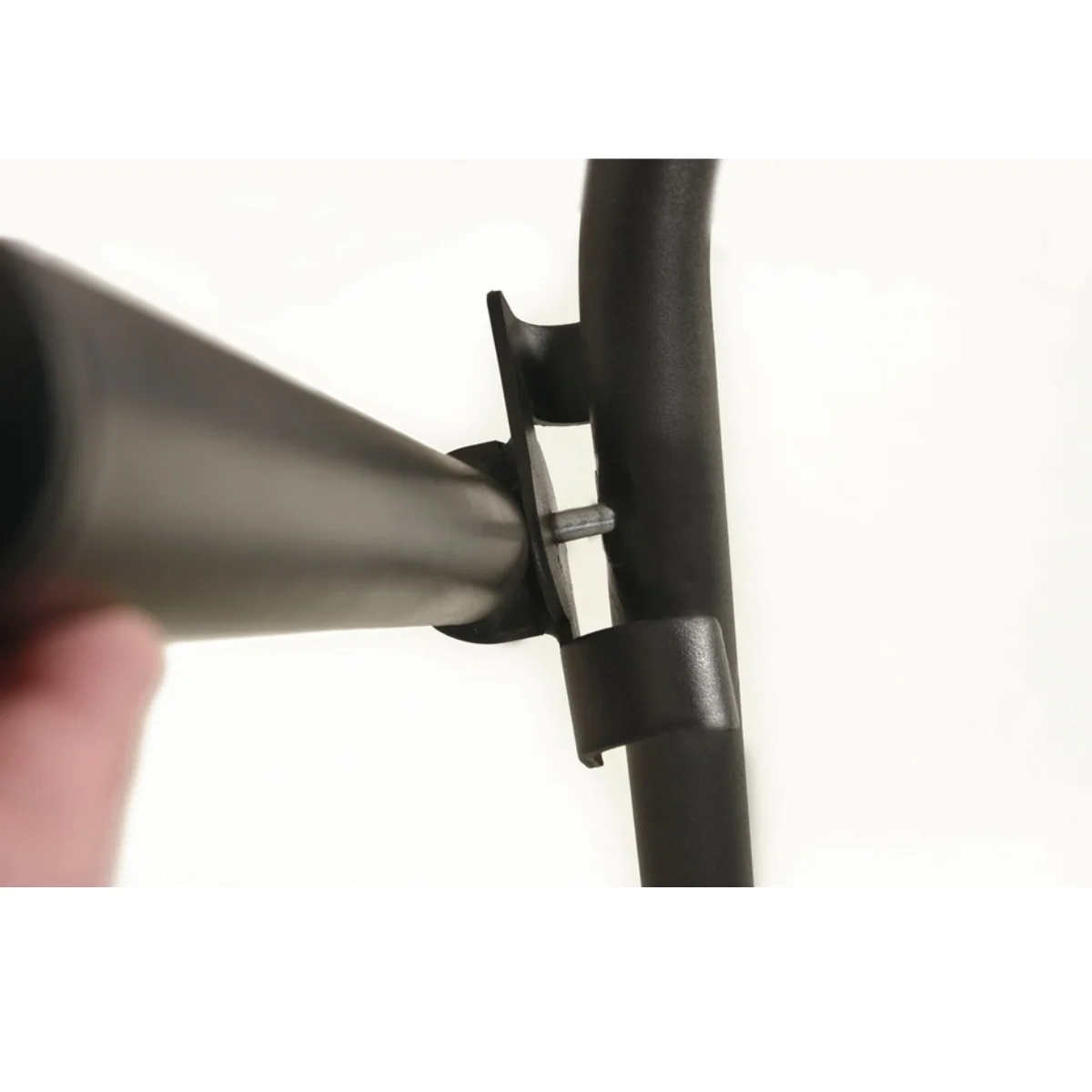 Two pieces of black plastic connecting. One is holding another, the other is a tube.