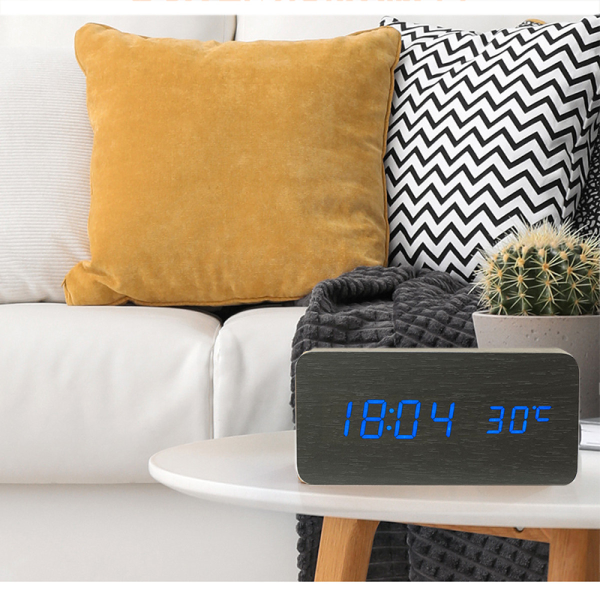 Wooden digital clock with a blue display showing time and temperature.