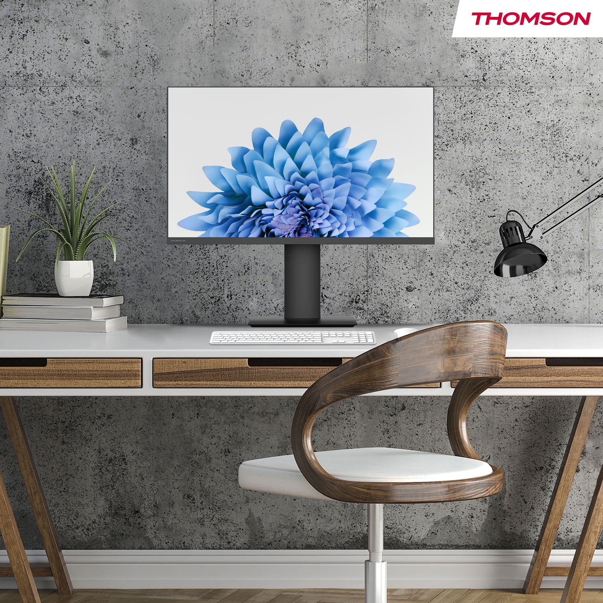 Monitor auf Schreibtisch, zeigt blaues Blumenbild, mit Stuhl und Lampe.