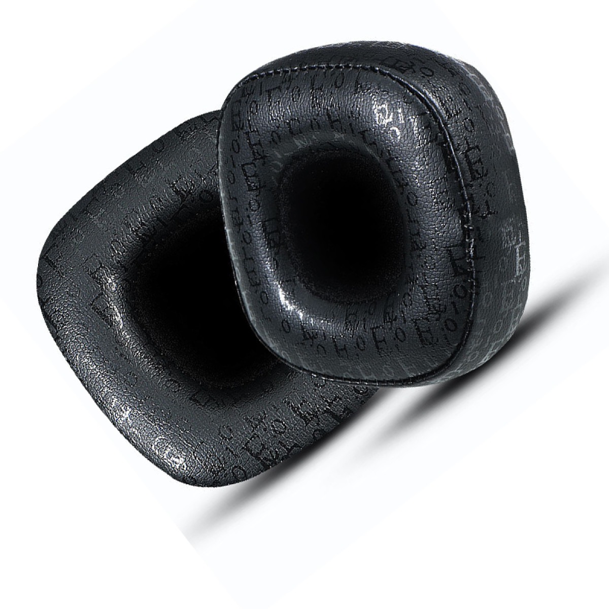 Dwie czarne nauszniki. Jeden ma lekki kąt, a drugi leży płasko.