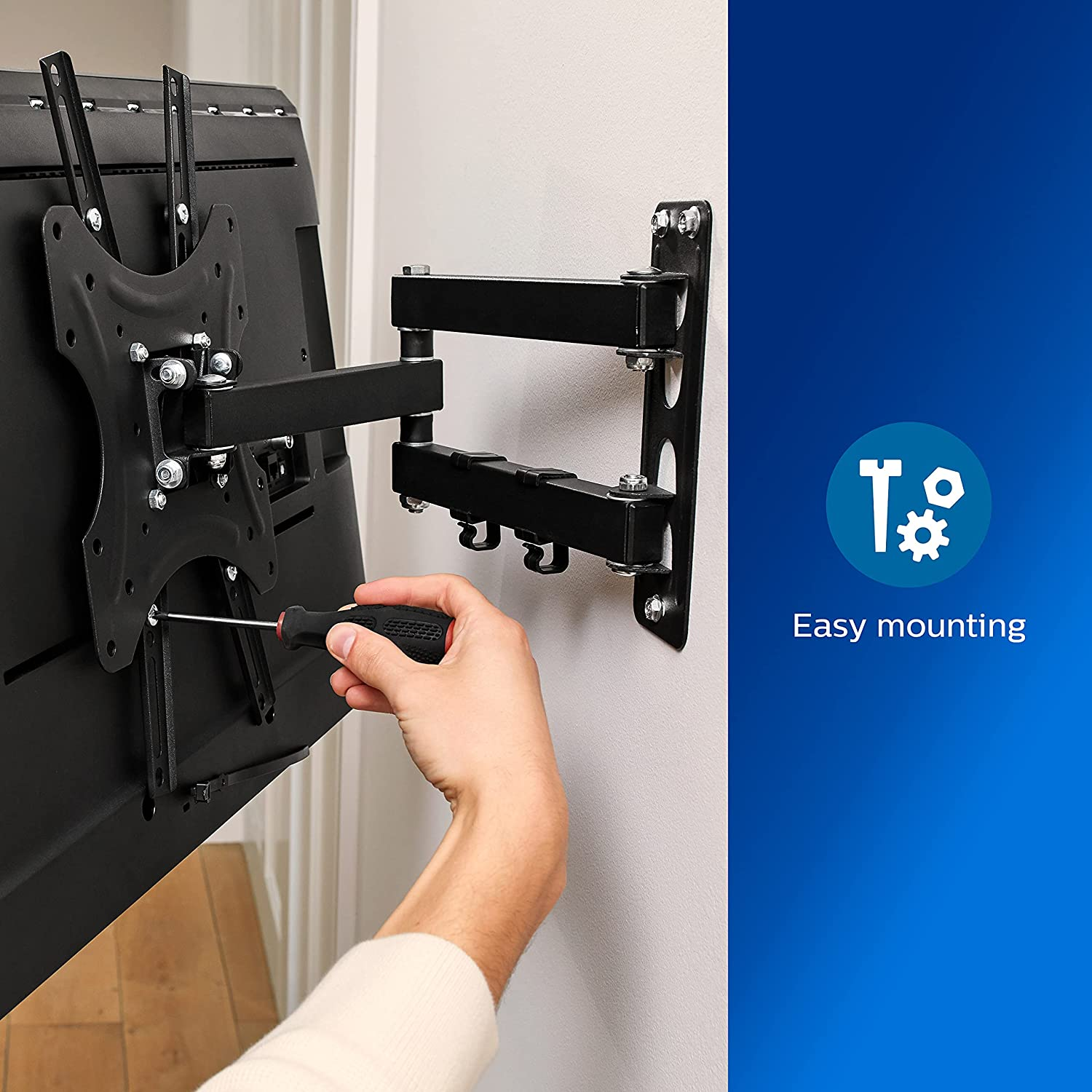 Eine Person installiert eine TV-Halterung an einer Wand. Text: Easy mounting. Die Halterung ist schwarz.