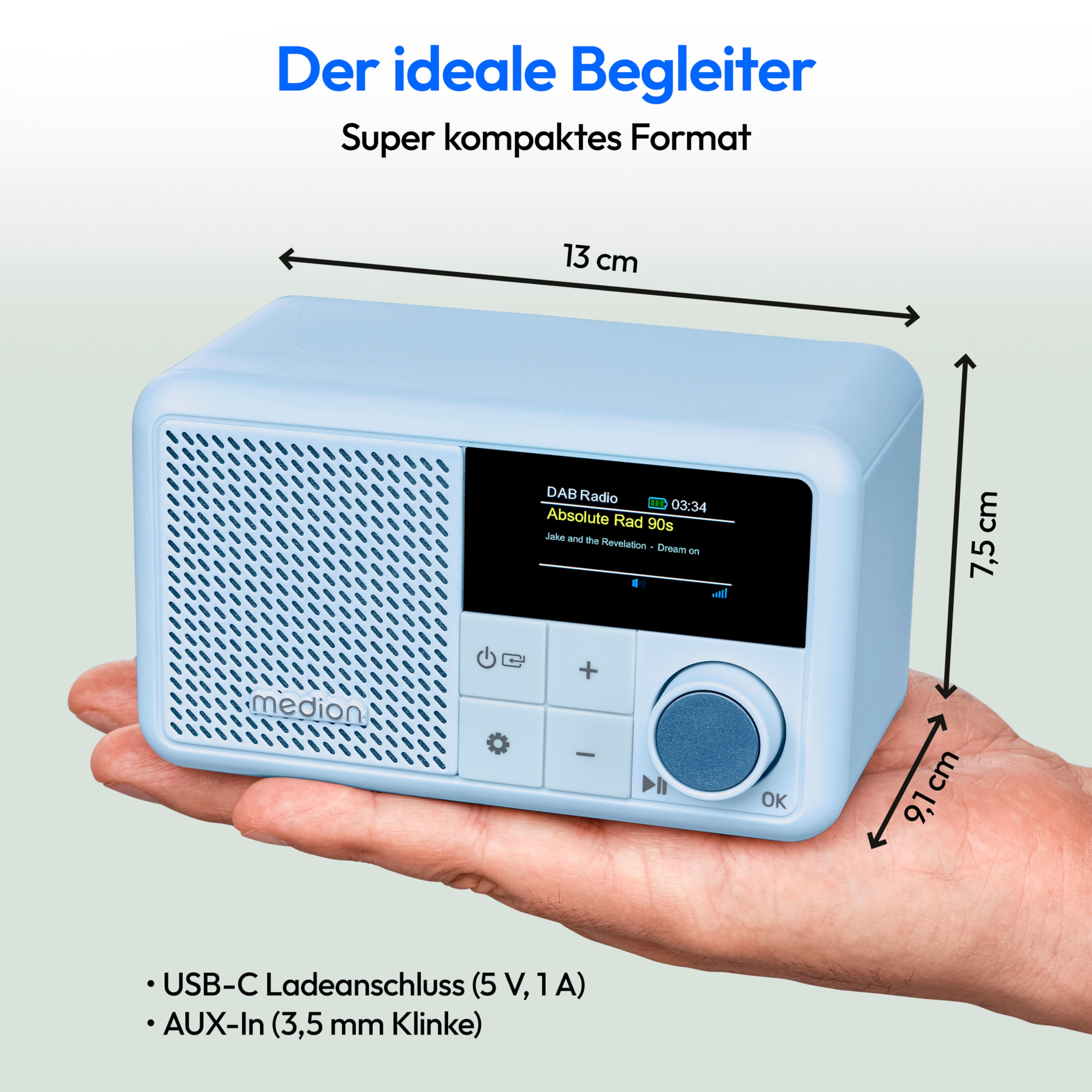 A person's hand holding a light blue radio with dimensions and features.