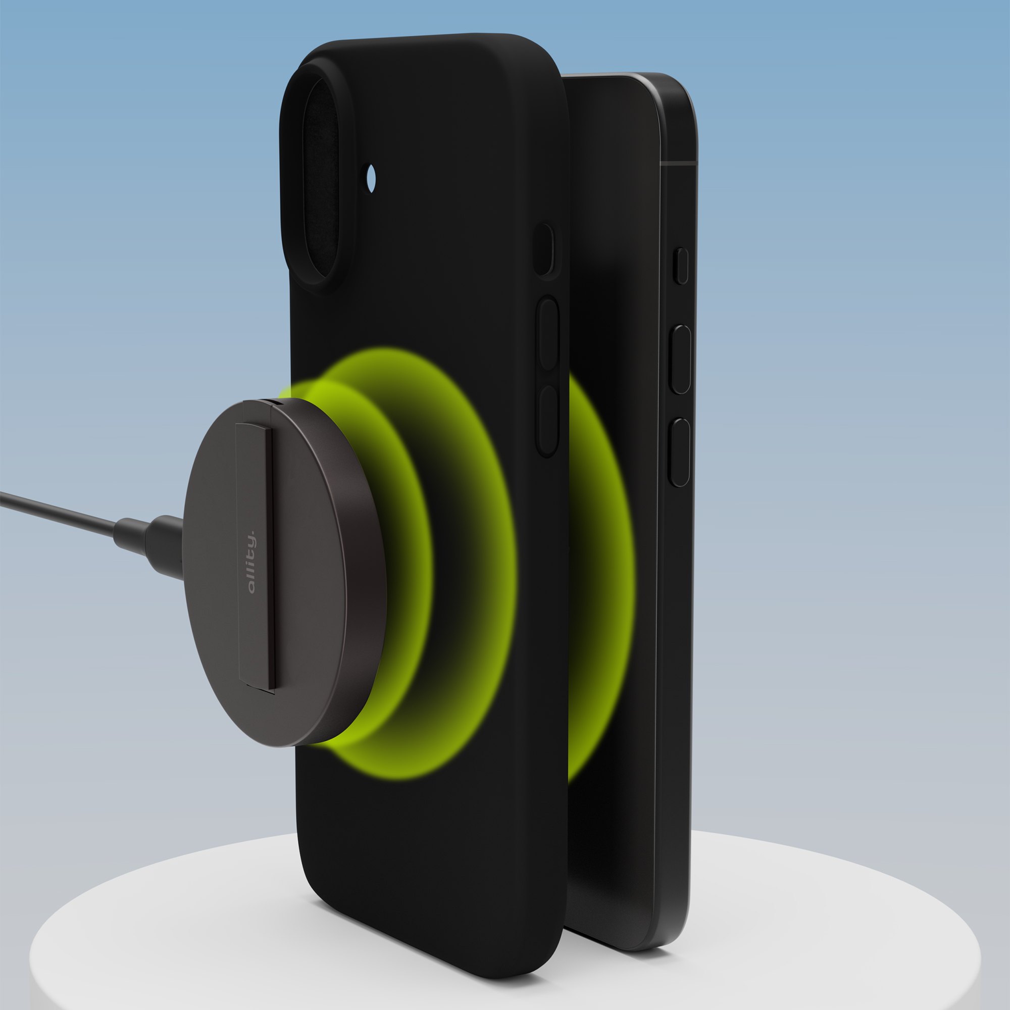 Czarne etui na telefon z dołączoną ładowarką magnetyczną. Zielone kręgi energii pojawiają się wokół telefonu.