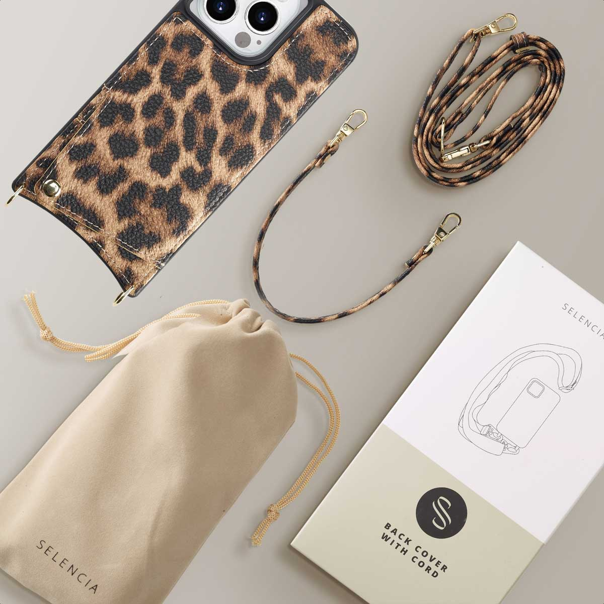 Coque de téléphone avec un imprimé léopard, une sangle, une pochette et une boîte avec un schéma de cordon.