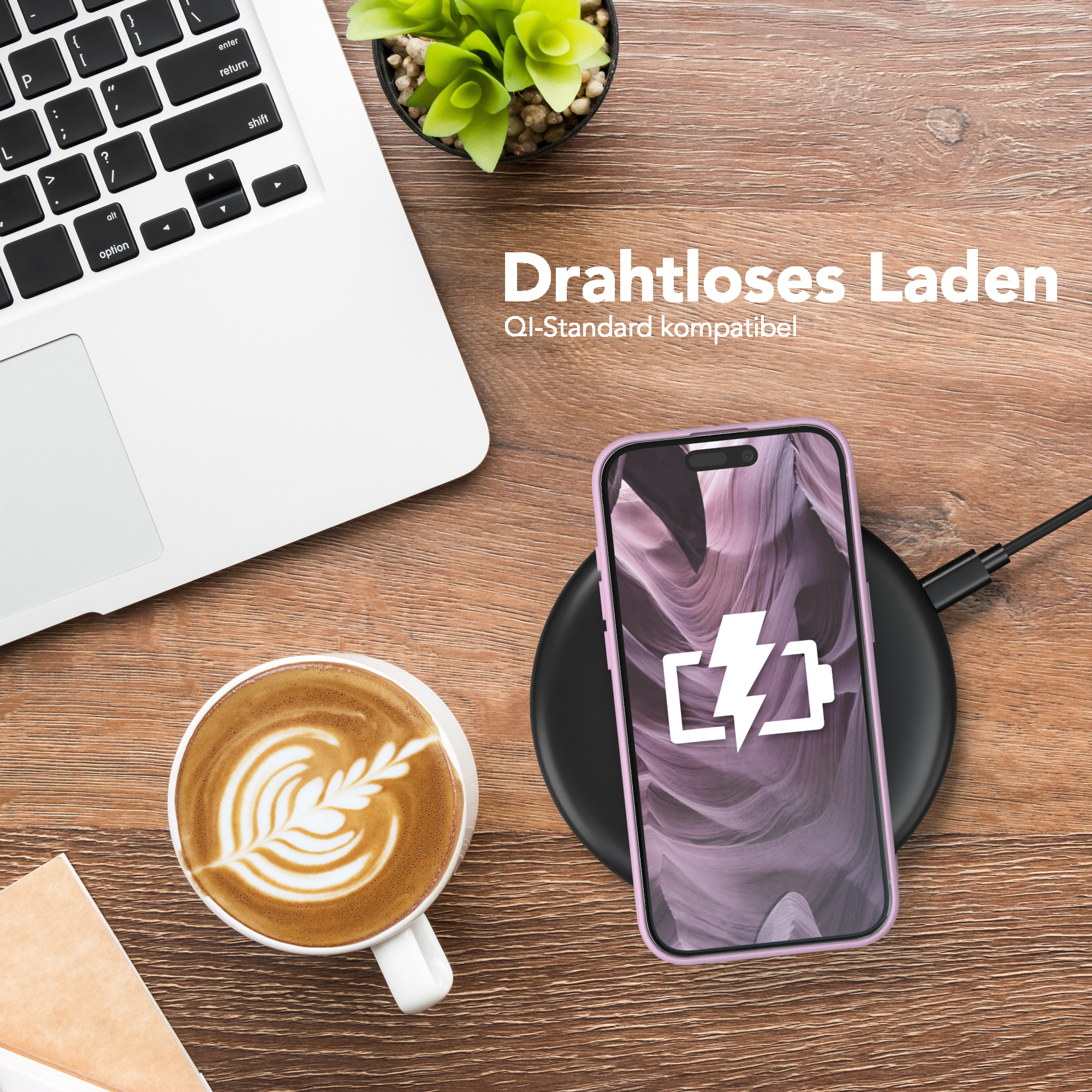 Telefon wird drahtlos auf einem Pad geladen, neben einem Laptop und einer Kaffeetasse. Text 'Wireless Charging'.