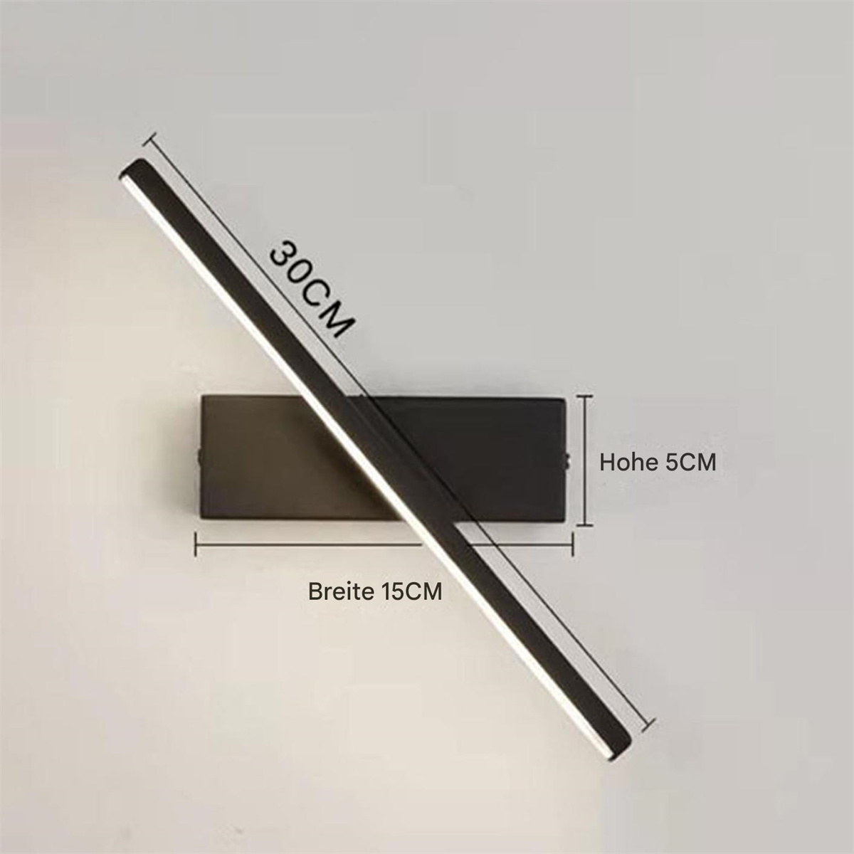 Eine schwarze Wandleuchte mit einer rotierenden Lichtleiste. Abmessungen sind angegeben: 30 cm lang, 15 cm breit und 5 cm hoch.