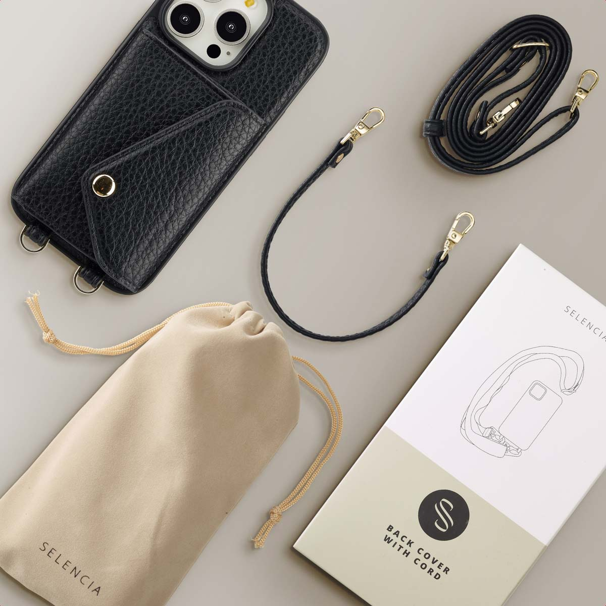 Coque de téléphone noire avec une sangle, une pochette et une boîte avec une illustration de coque.