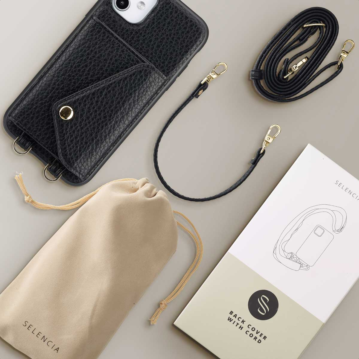 Coque de téléphone noire avec une poche, une sangle et une pochette beige.