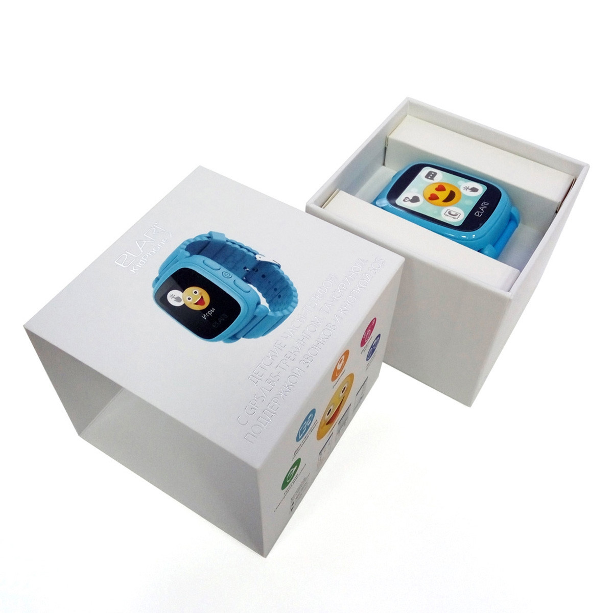 Un reloj inteligente azul en una caja blanca. Otro reloj está sobre la caja. El fondo es blanco.