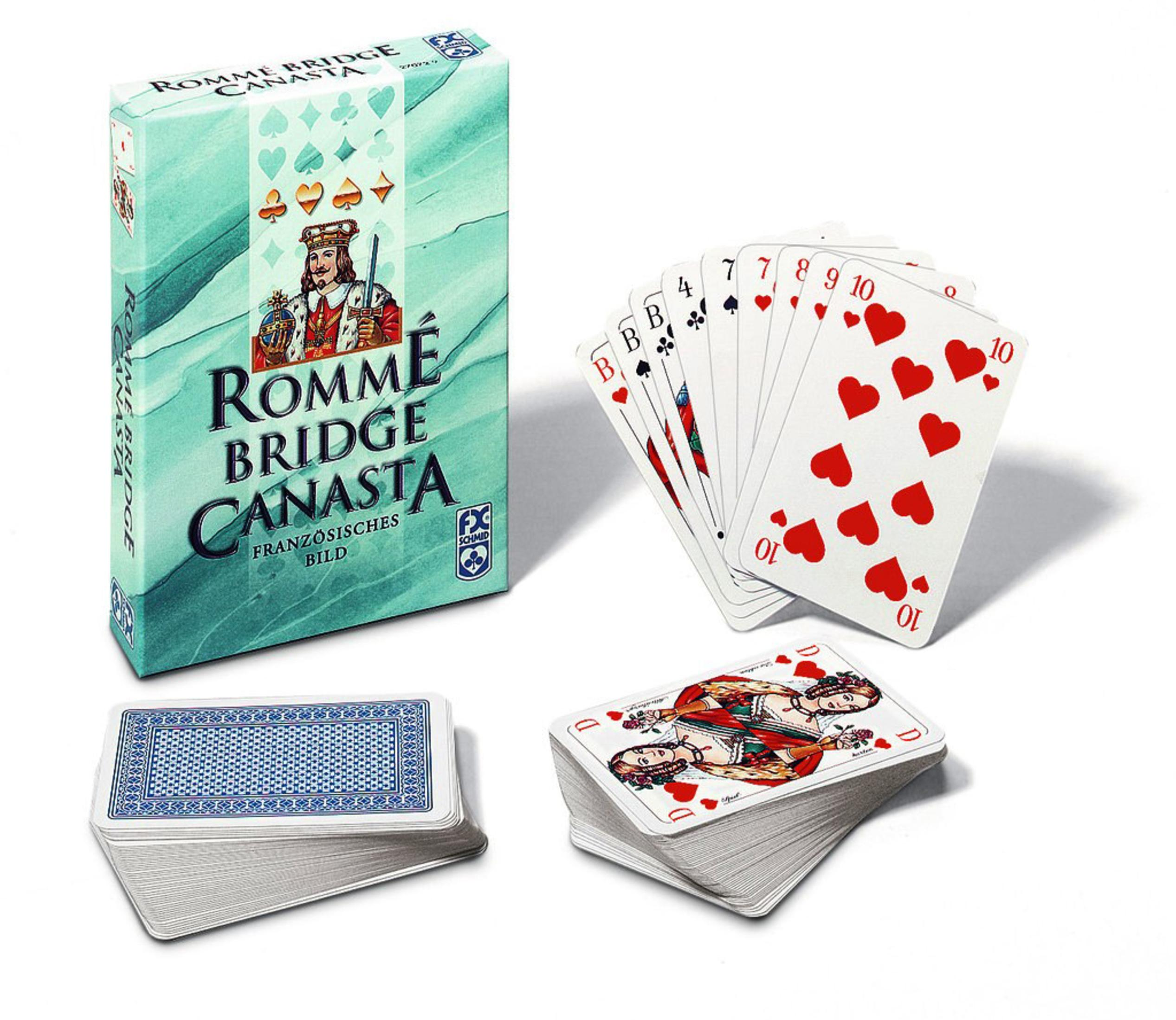 Eine Schachtel mit Rommé Bridge Canasta-Karten. Ein Kartenspiel liegt neben der Schachtel. Ein Stapel Karten ist unten.