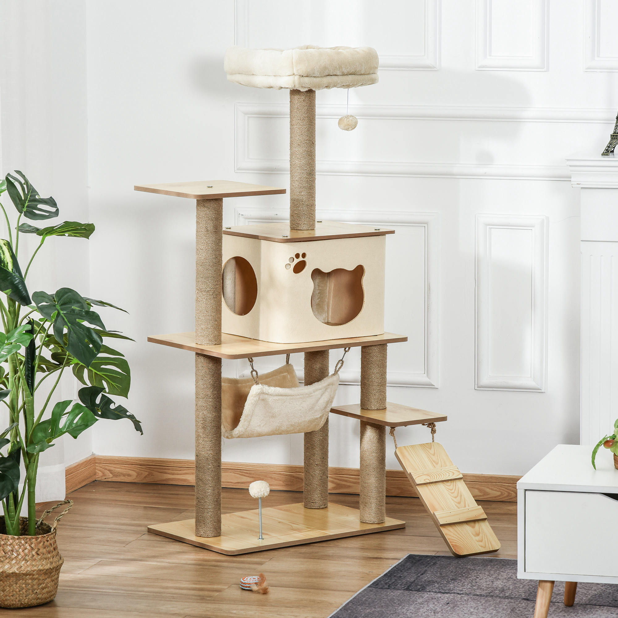 Un árbol para gatos de varios niveles con una casa, una hamaca y una escalera. Incluye una huella de pata de gato.