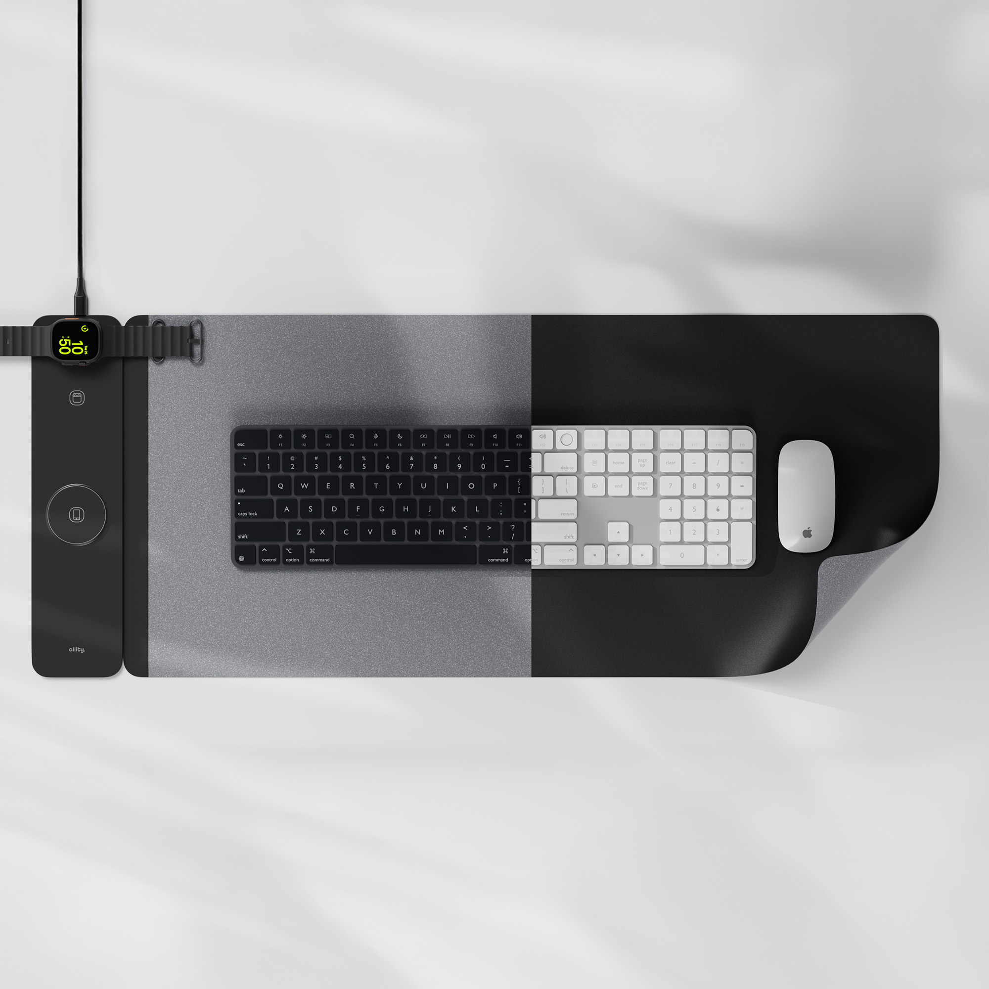 Podkładka pod mysz z klawiaturą i myszą. Jest podzielona na dwie sekcje kolorystyczne.