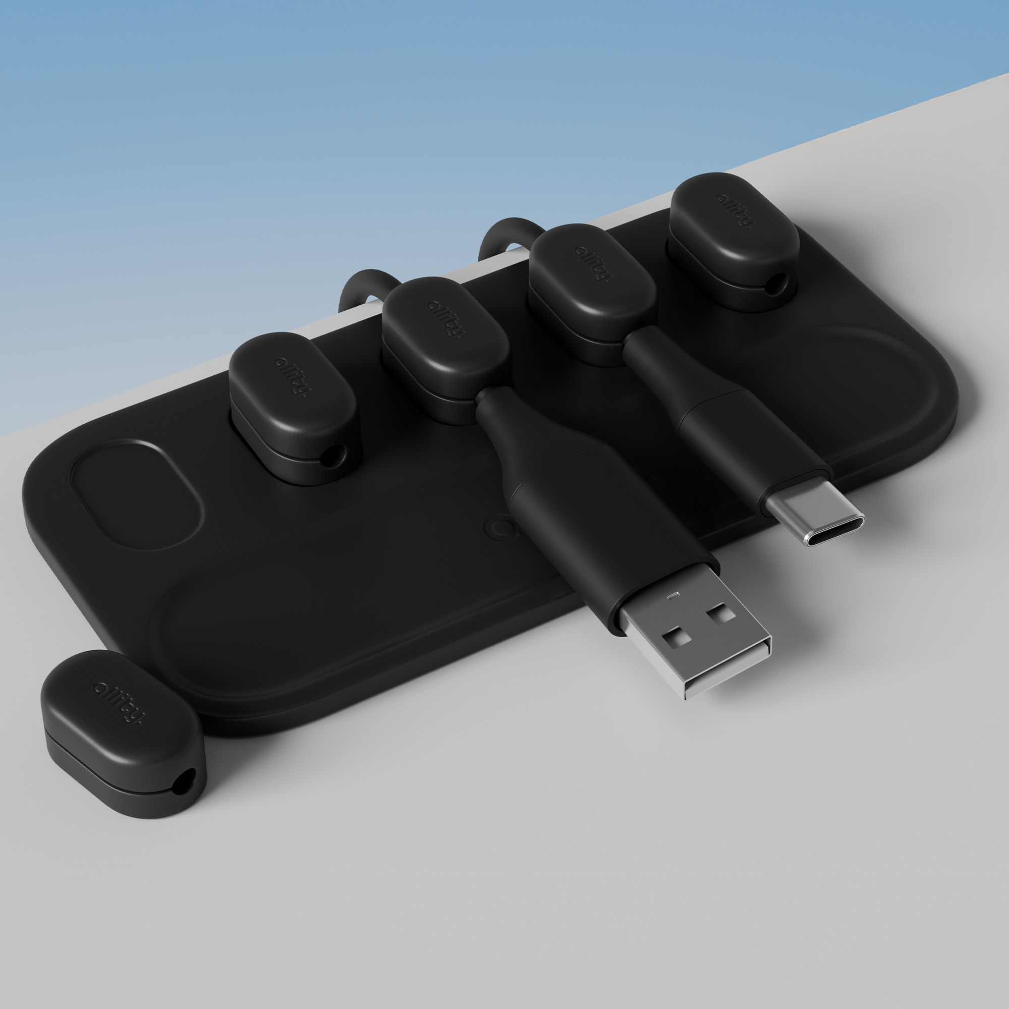 Czarna stacja ładowania z wieloma złączami. Tło jest jasnoniebieskie i białe.