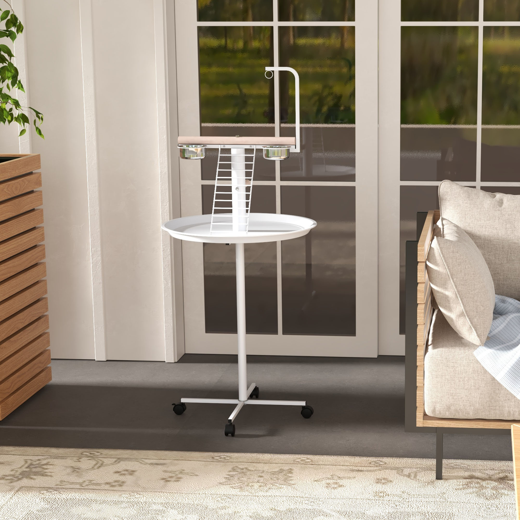 Un soporte blanco para pájaros con comederos y bebederos, una escalera y una percha. Colocado frente a una ventana.