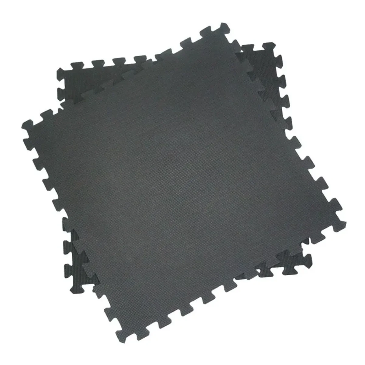 Interlocking black floor mats, arranged on a white surface.