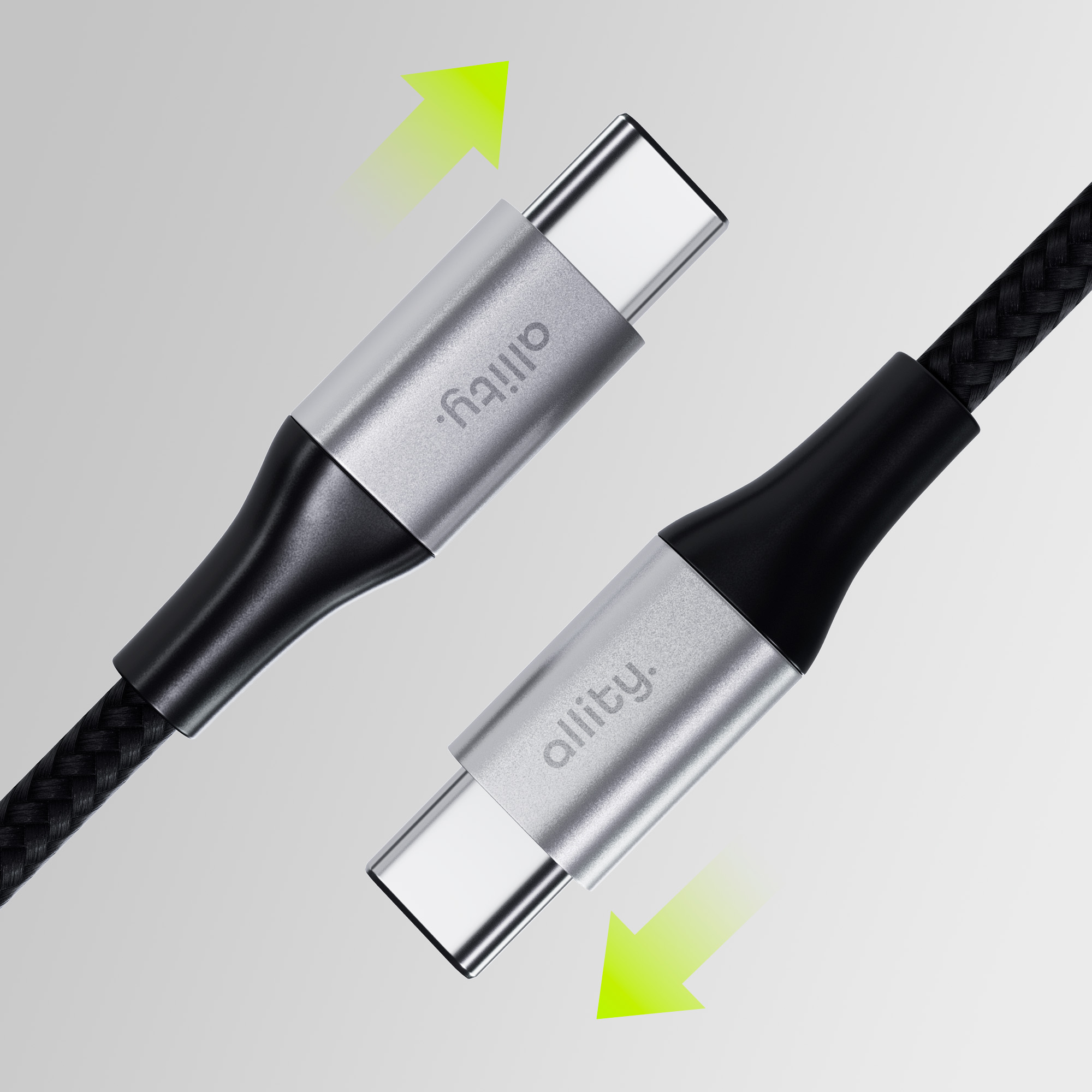 Dwa srebrno-czarne kable USB-C z zielonymi strzałkami wskazującymi na złącza.