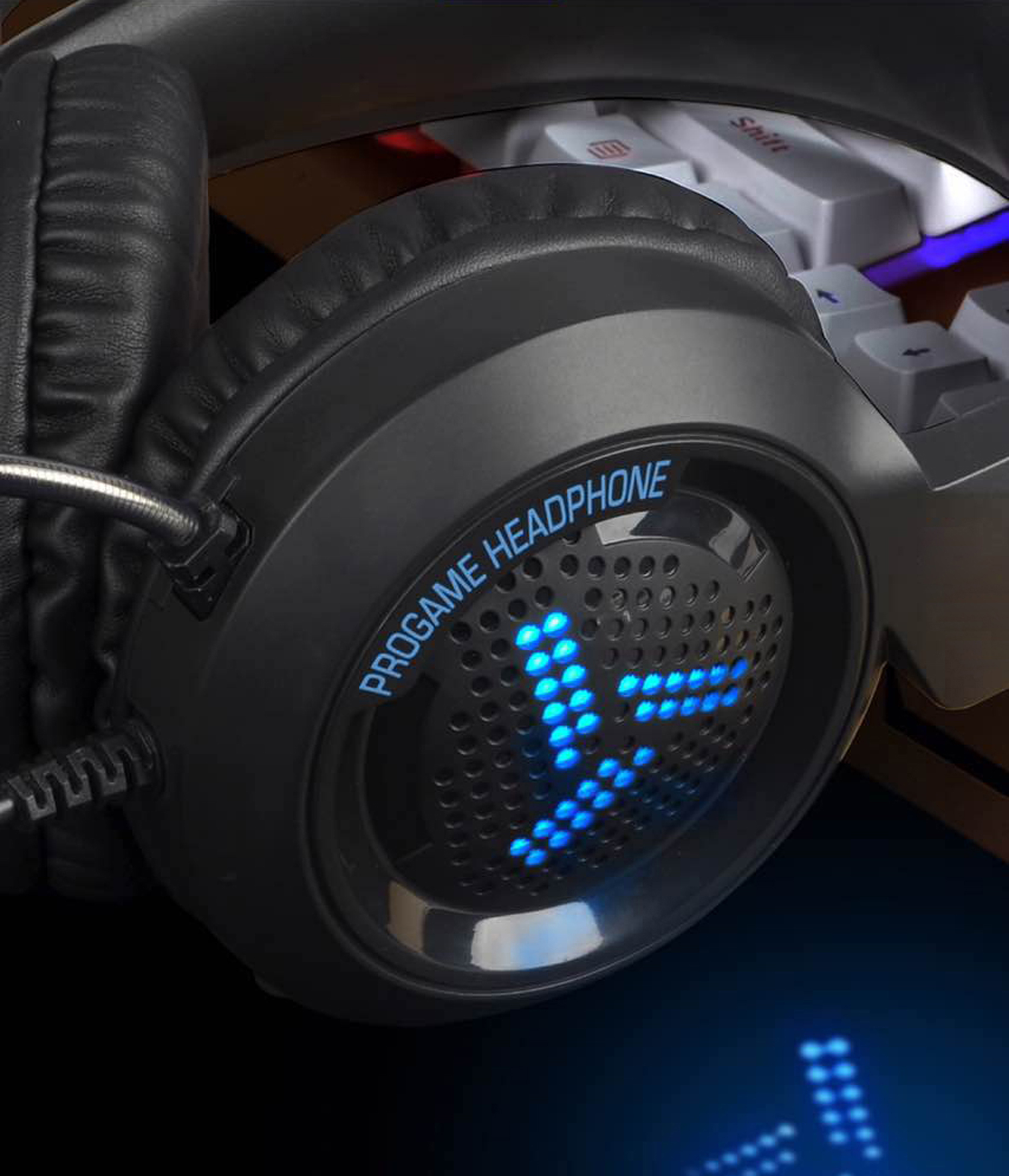 Close-up of a black gaming headset with blue LED lights and the words "PRO GAME HEADPHONE".