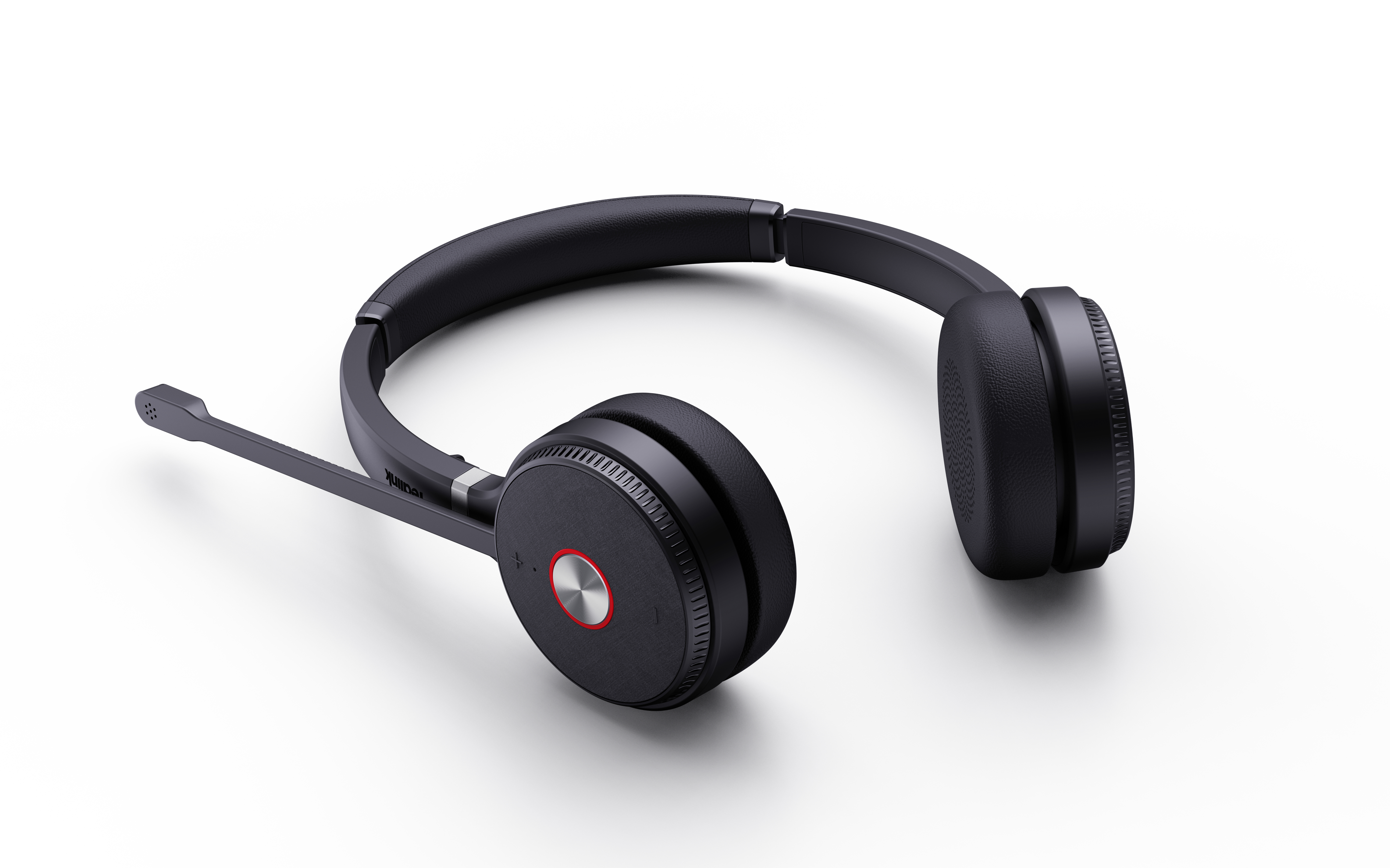 Casque-micro noir avec un microphone sur le côté gauche. Les écouteurs sont ronds et l'arceau incurvé.
