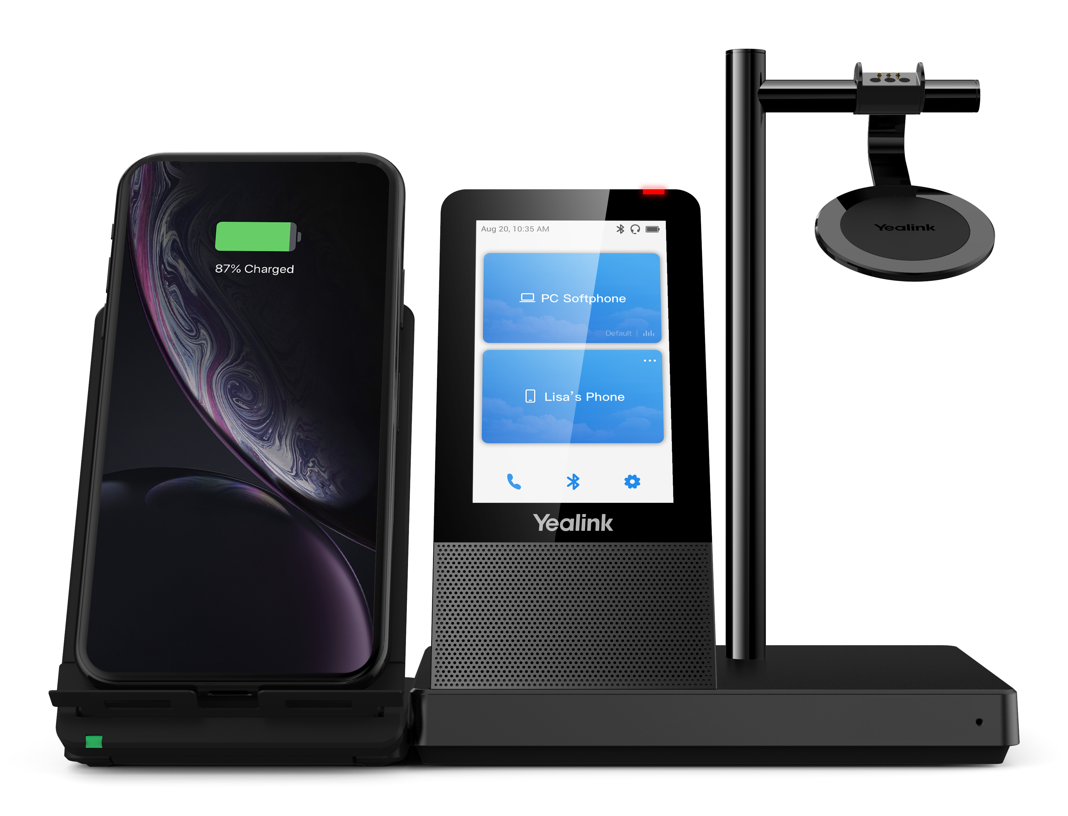 Czarny telefon stacjonarny z telefonem ładującym telefon komórkowy.