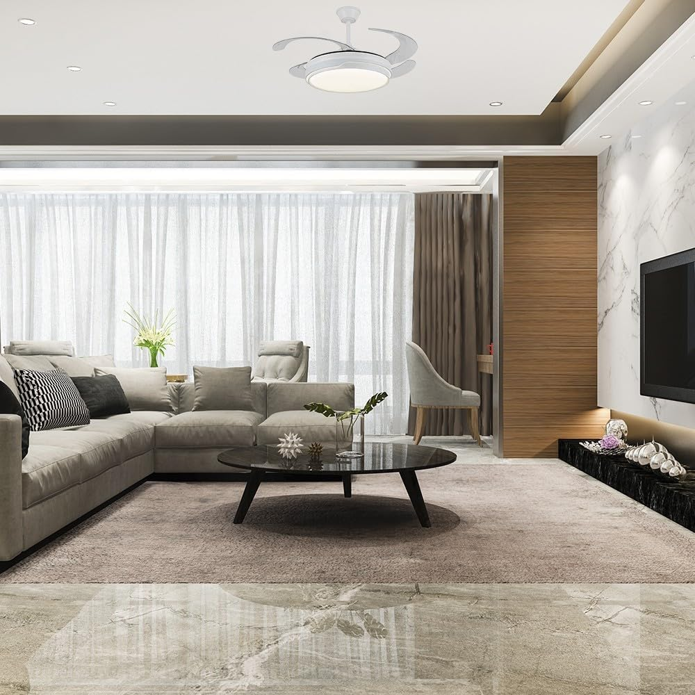 Salón moderno con sofá, mesa de centro y ventilador de techo.