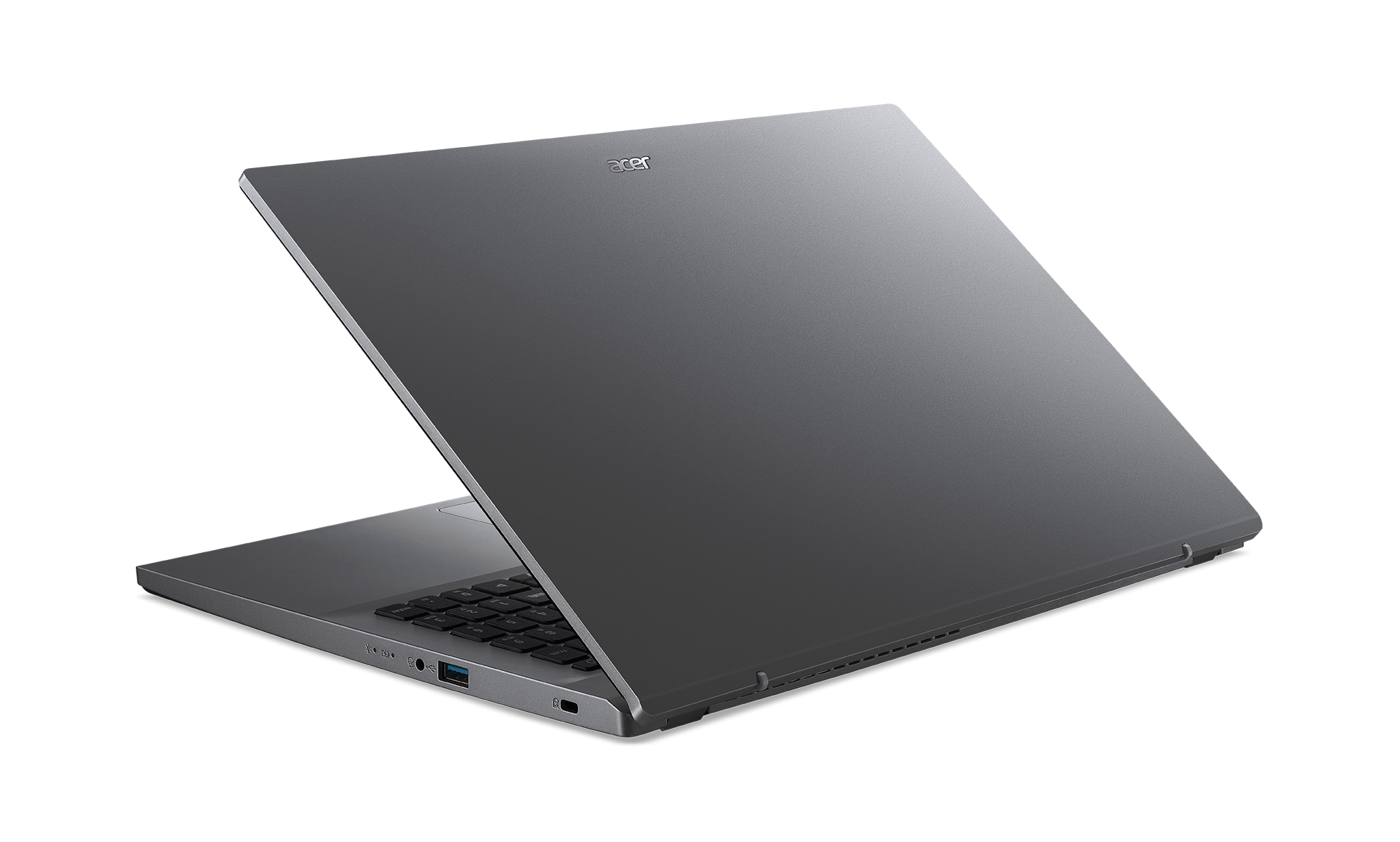 Laptop grigio con logo Acer, aperto su superficie bianca. Tastiera visibile. Vista angolata, sfondo bianco.