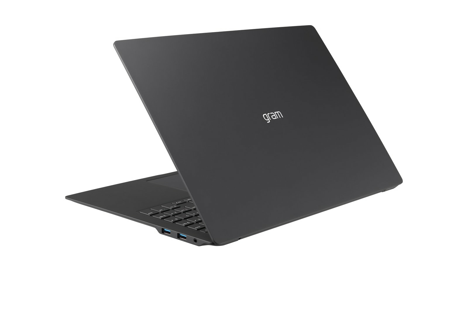 Czarny laptop z tyłu. Jest otwarty, widać klawiaturę i część ekranu.