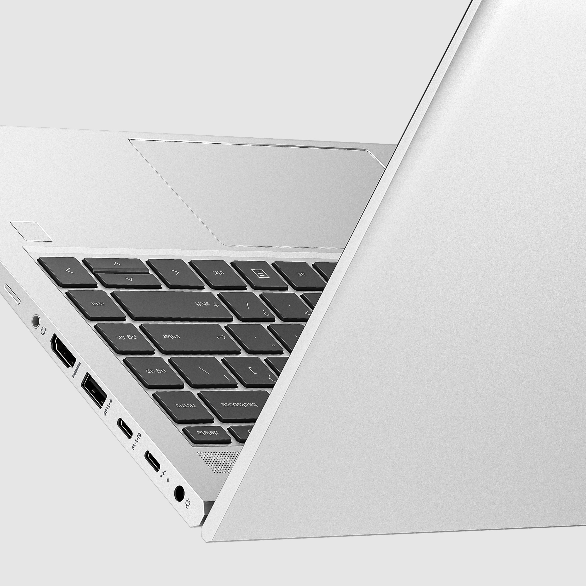 Tastiera, porte e trackpad del laptop. Superficie bianca. Tasti neri. Vista angolata. Sfondo bianco.