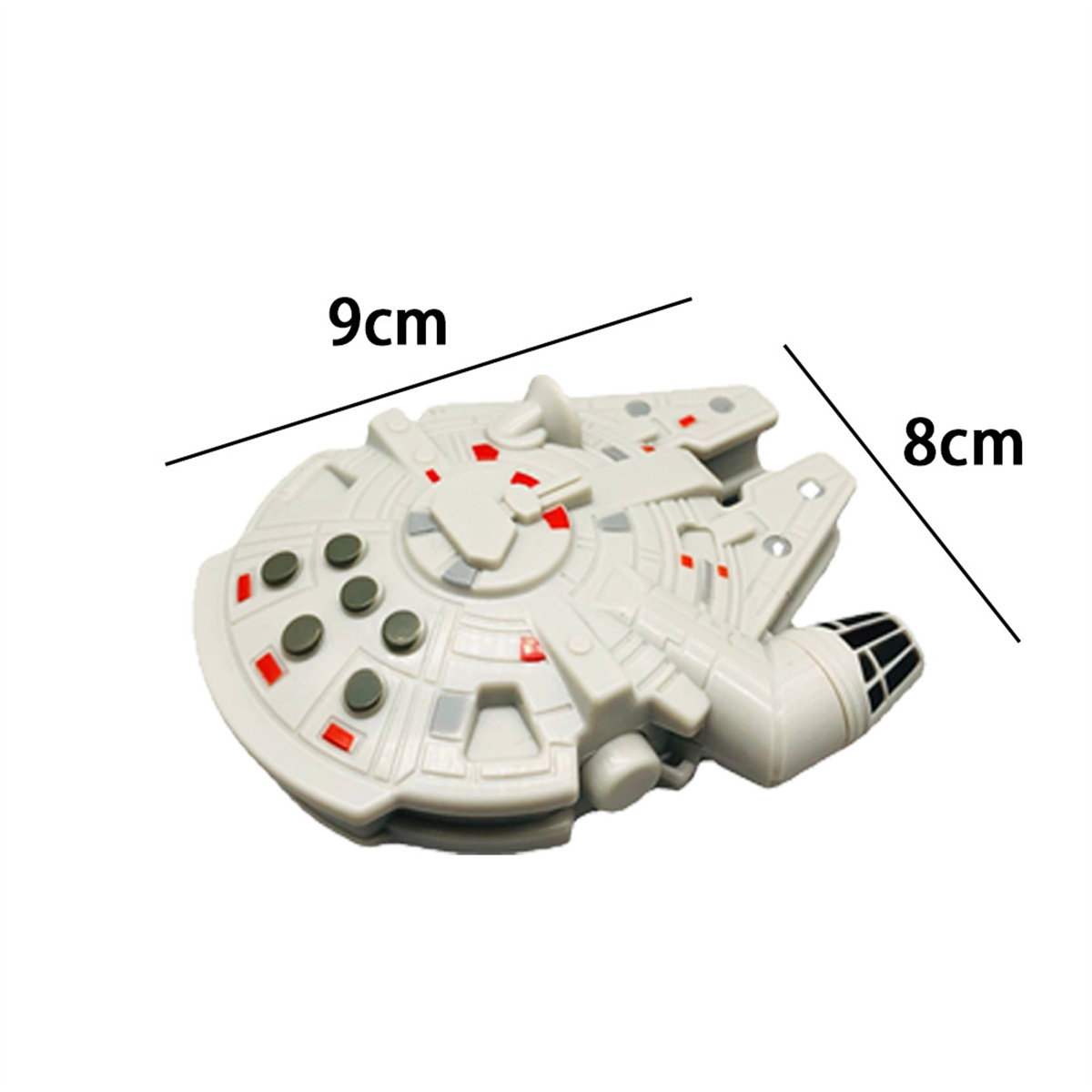 Weißes Spielzeug Millennium Falcon mit Maßen auf weißer Oberfläche.