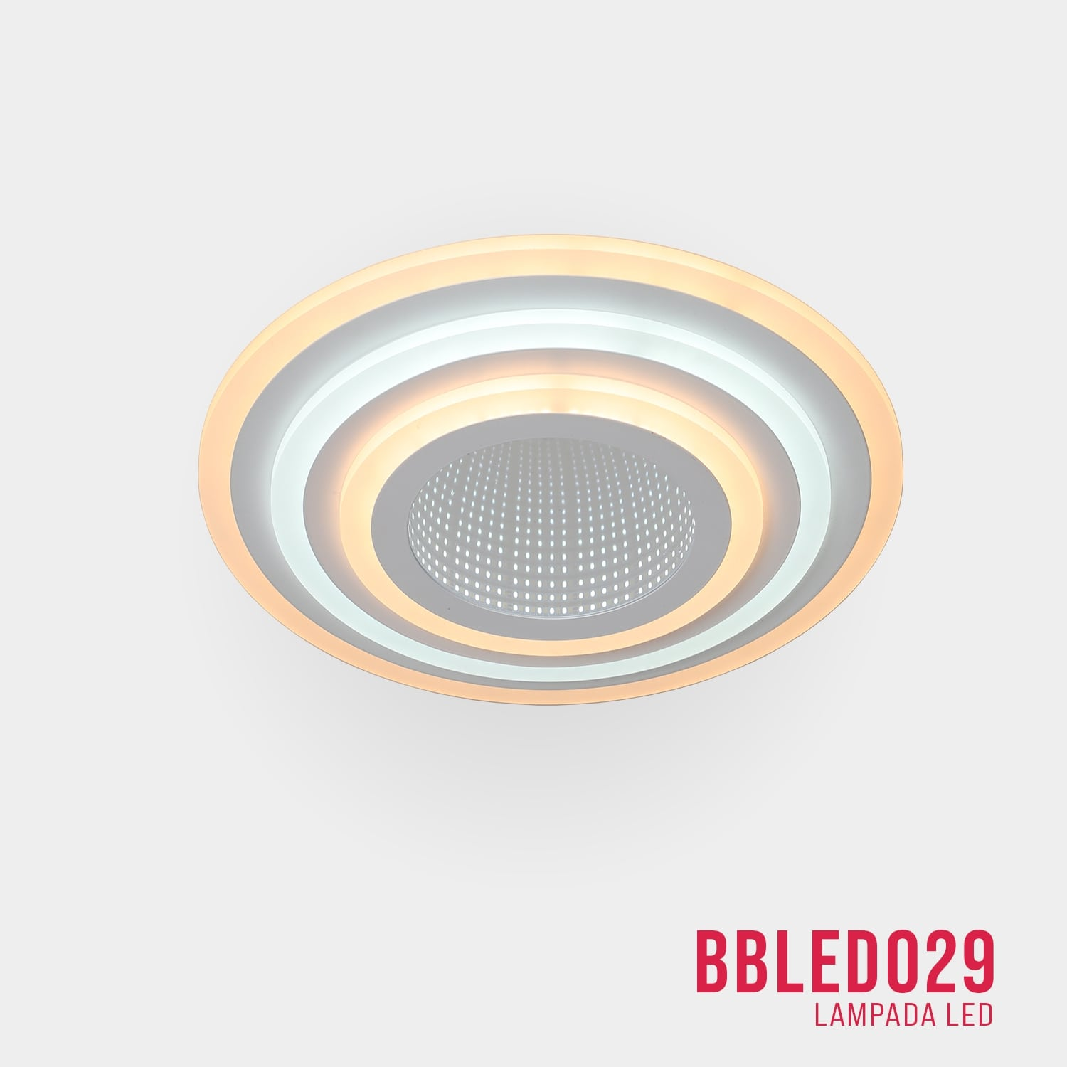 Lampada da soffitto circolare con più strati concentrici, chiara e bianca. Testo in basso: BBLEDO029.