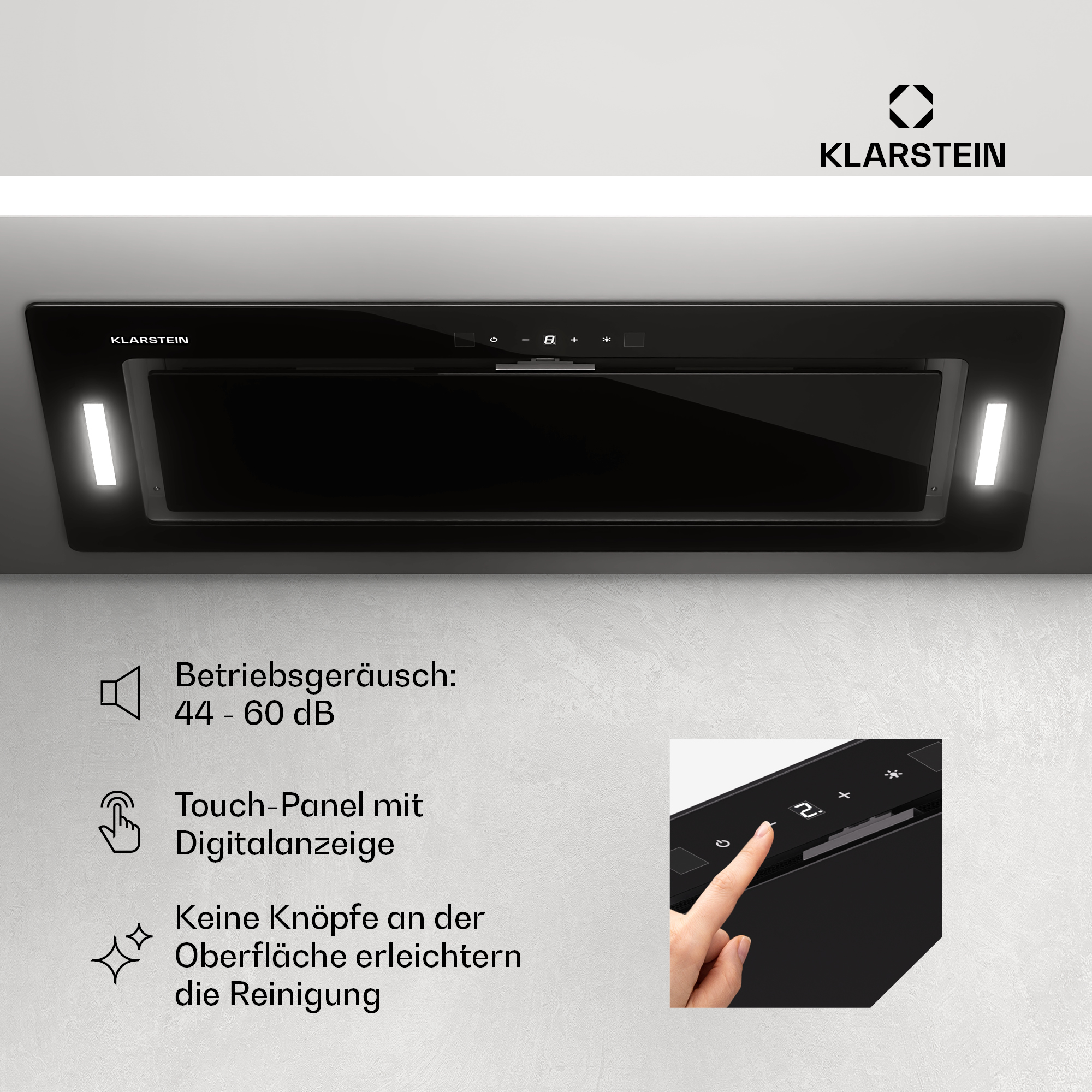 Schwarze Dunstabzugshaube mit Touchpanel und Lichtern. Text und eine Hand sind sichtbar.