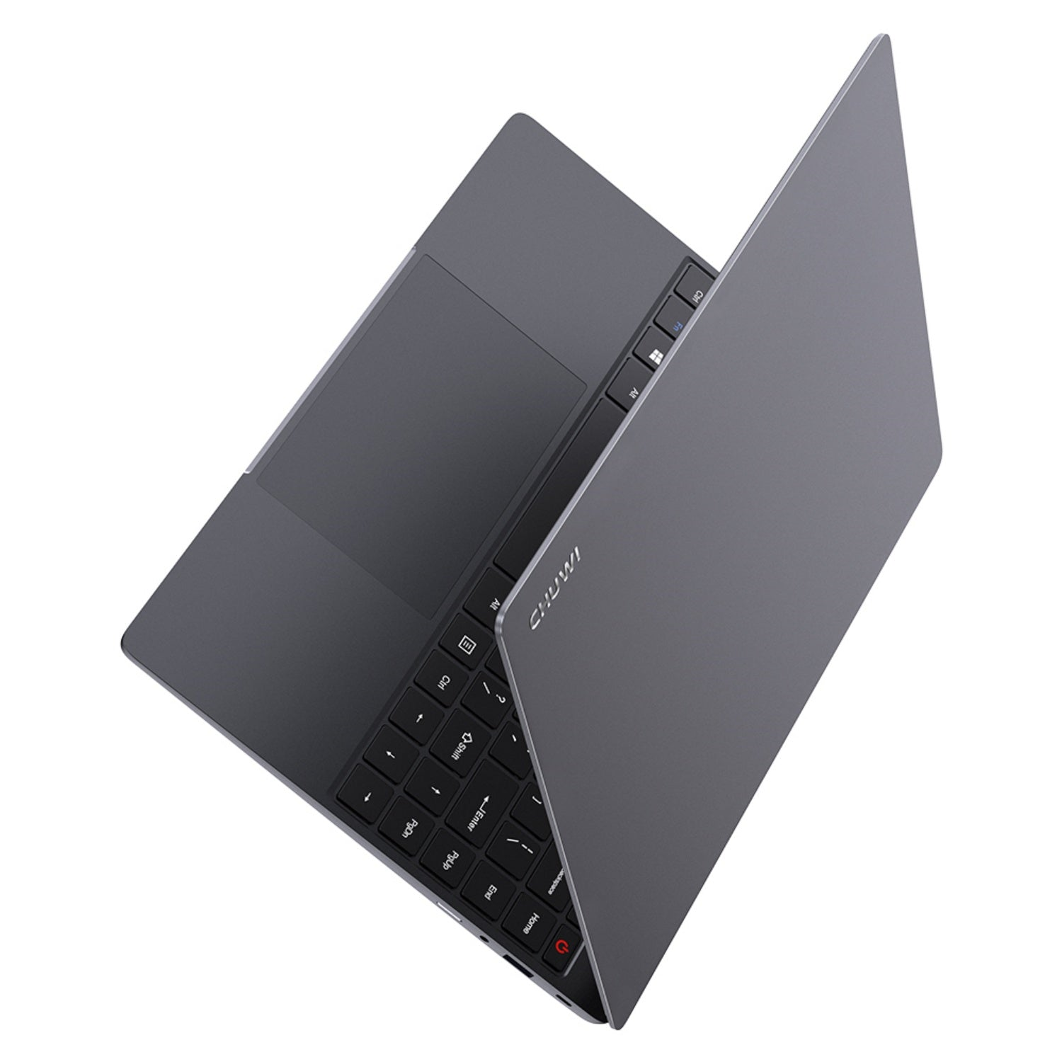 Ein grauer Laptop, der auf einer weißen Oberfläche geöffnet ist. Tastatur und Trackpad sind sichtbar. Draufsicht.