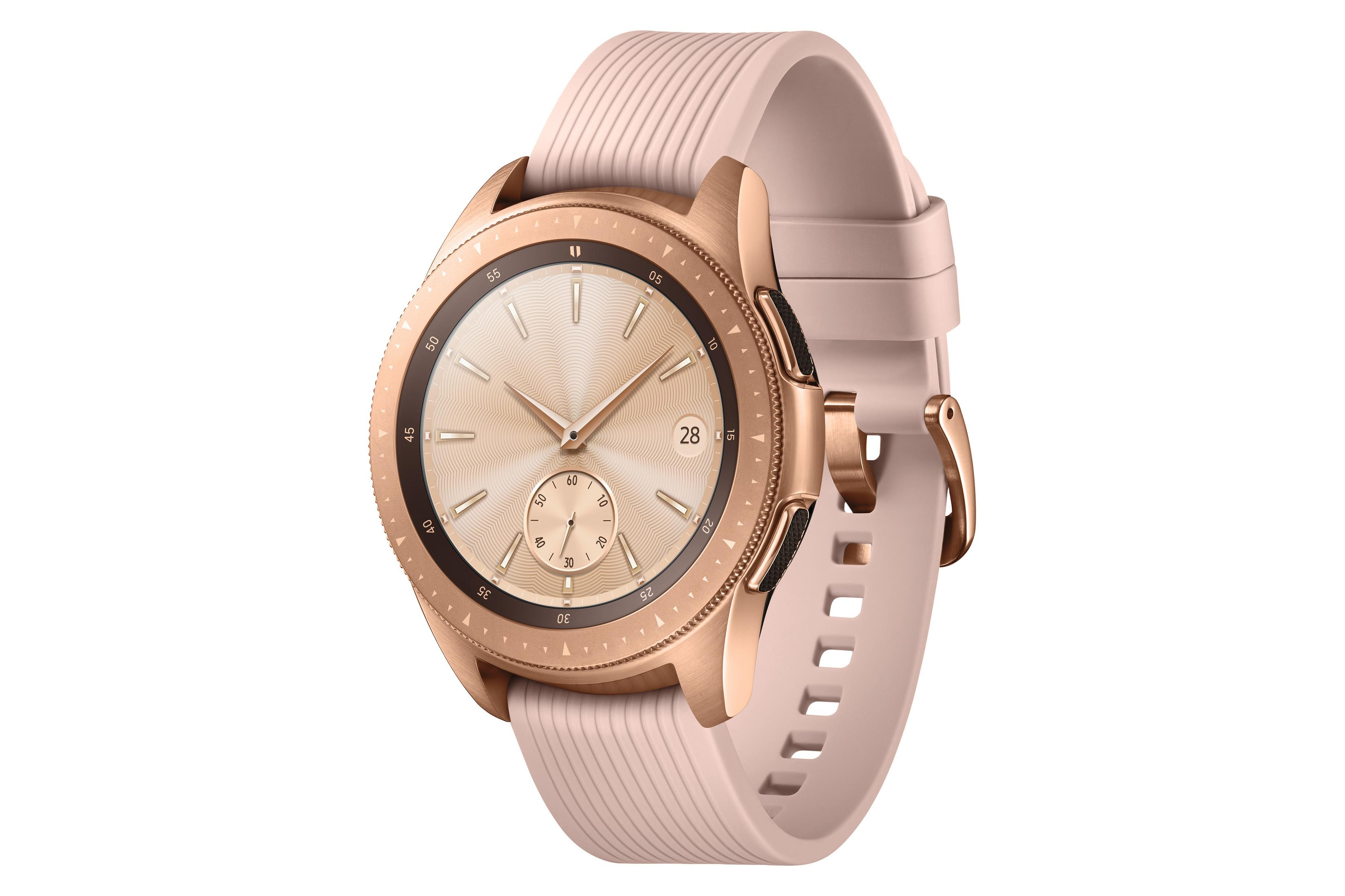 Roségoldene Smartwatch mit hellrosa Armband, auf weißem Hintergrund.