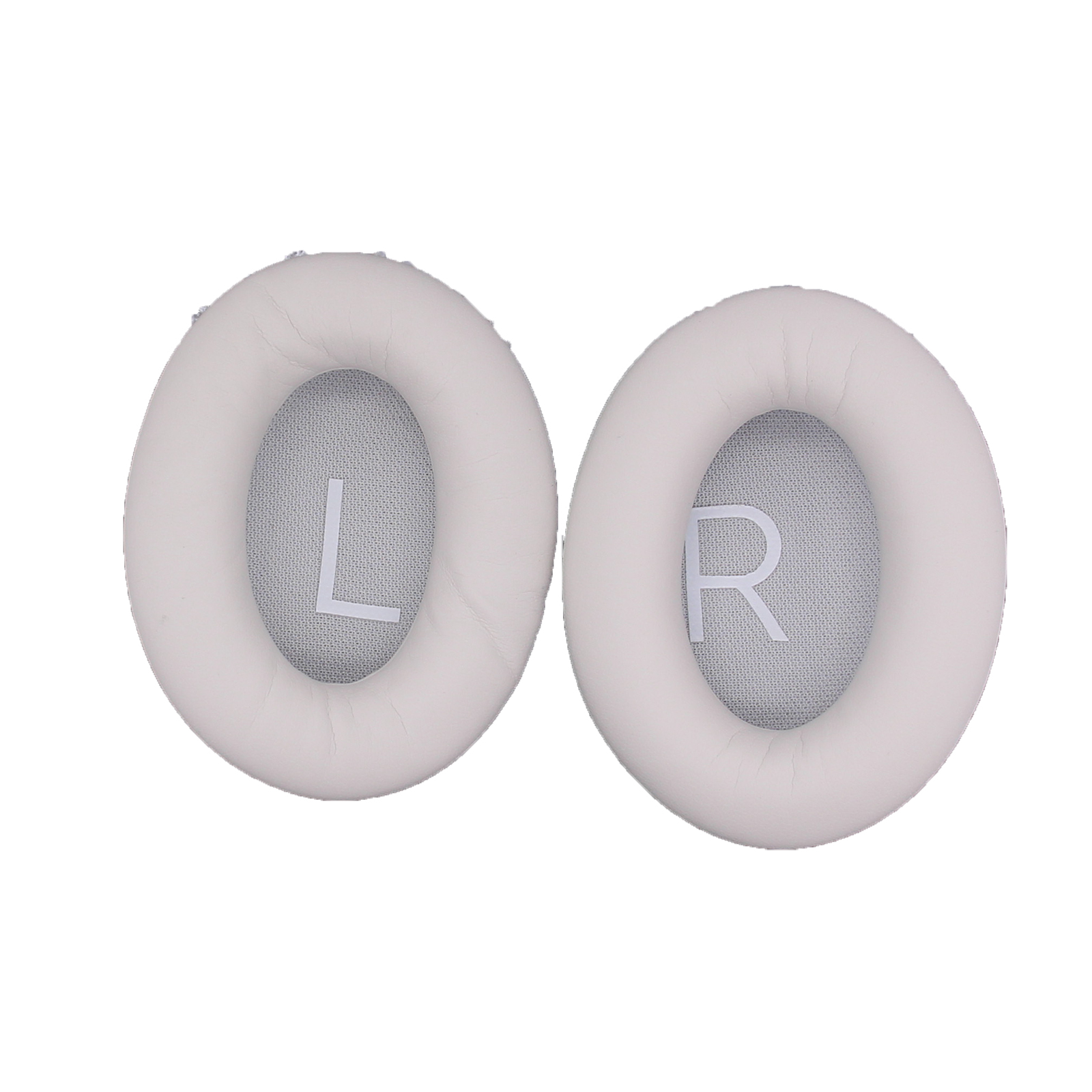 Dwie kremowe nauszniki z literami L i R na białym tle.