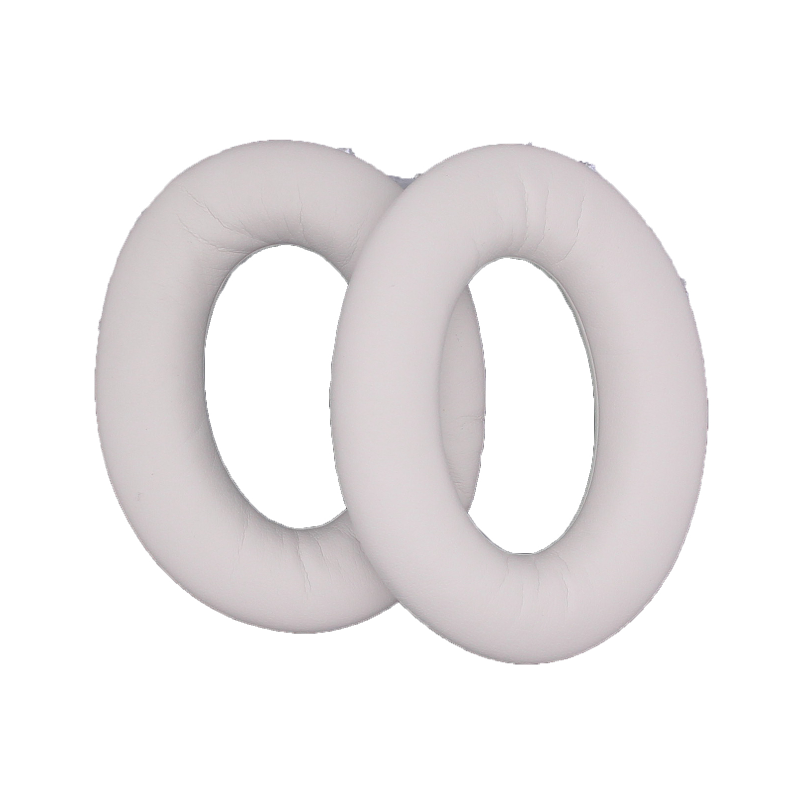 Dwie białe poduszki do słuchawek, okrągły kształt, izolowane na białym tle.