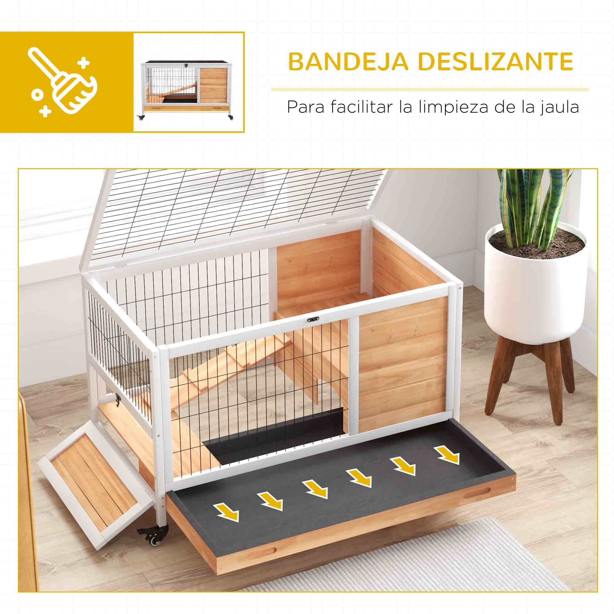 Una jaula para conejos con bandeja corredera para facilitar la limpieza. Colores blanco y madera.