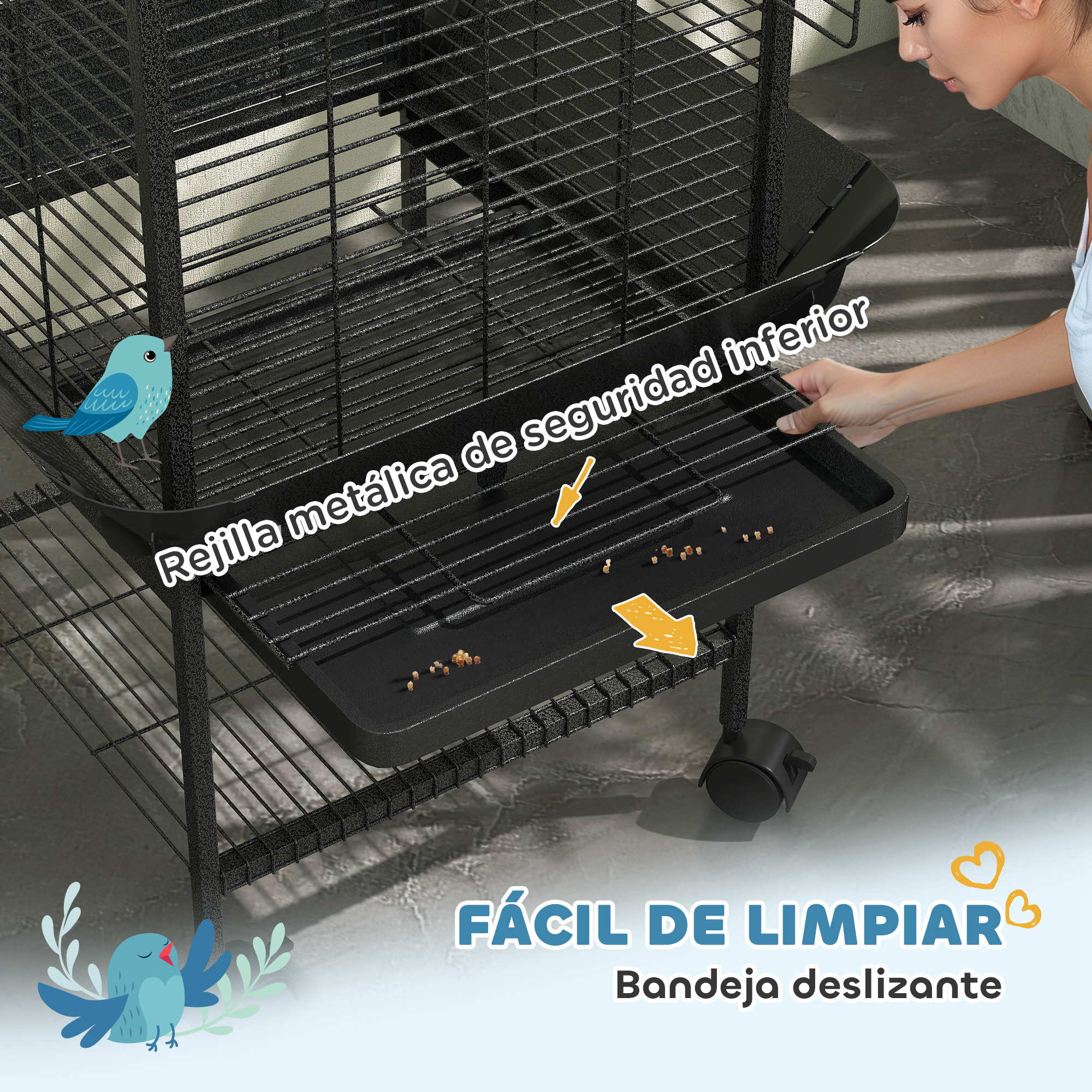 Una mujer limpiando una jaula negra para pájaros, con una bandeja deslizante y elementos decorativos.