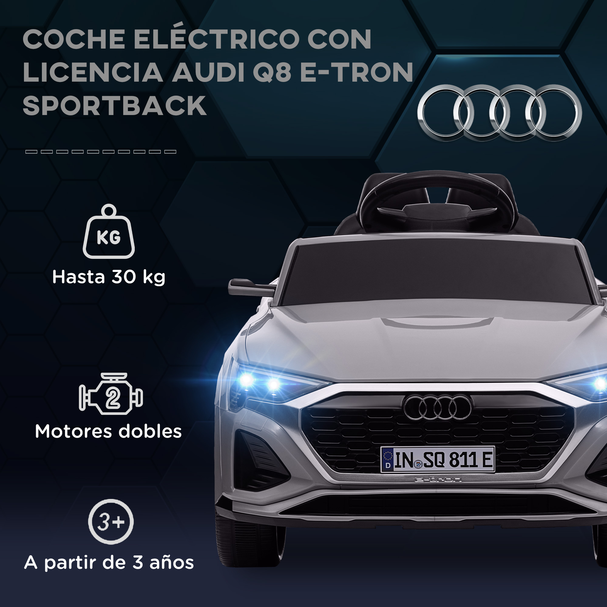Un coche eléctrico de juguete gris con el logo de Audi. El texto indica que es para mayores de 3 años.