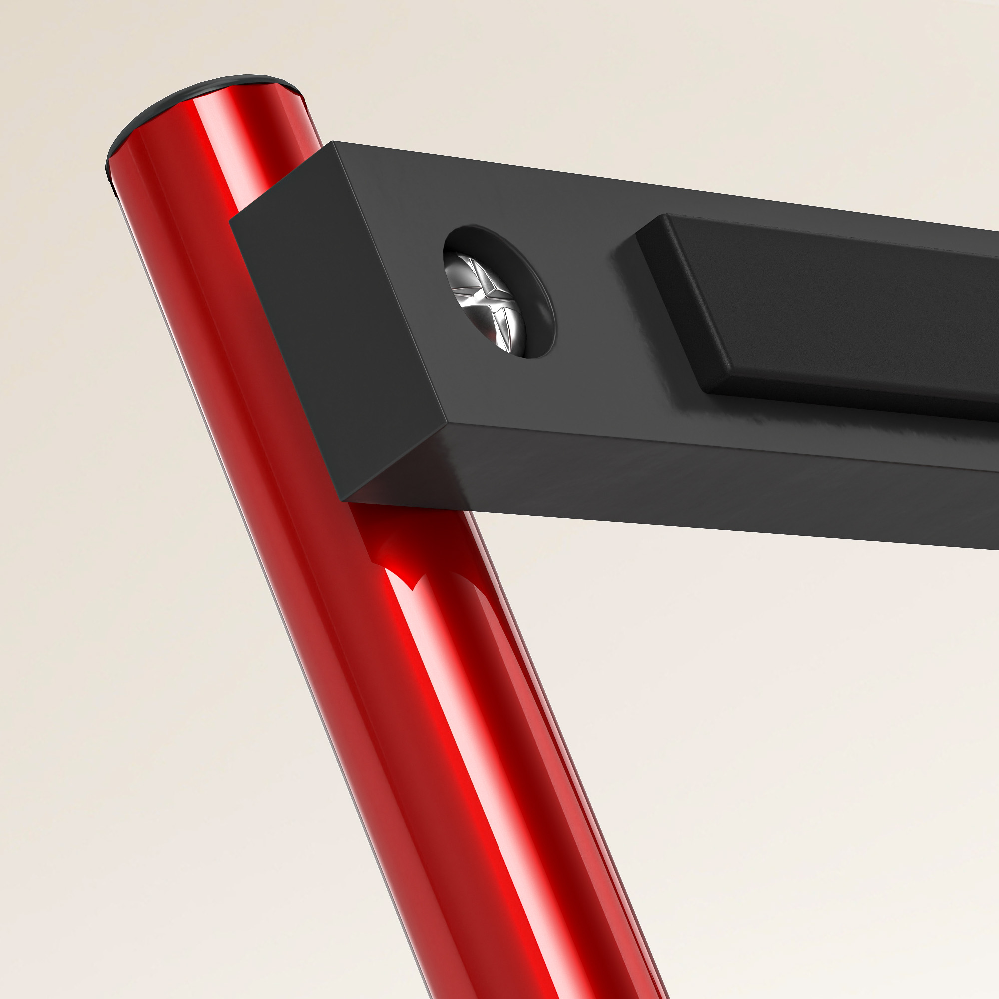Primer plano de un poste de soporte de metal rojo con una pieza de plástico negro atornillada.