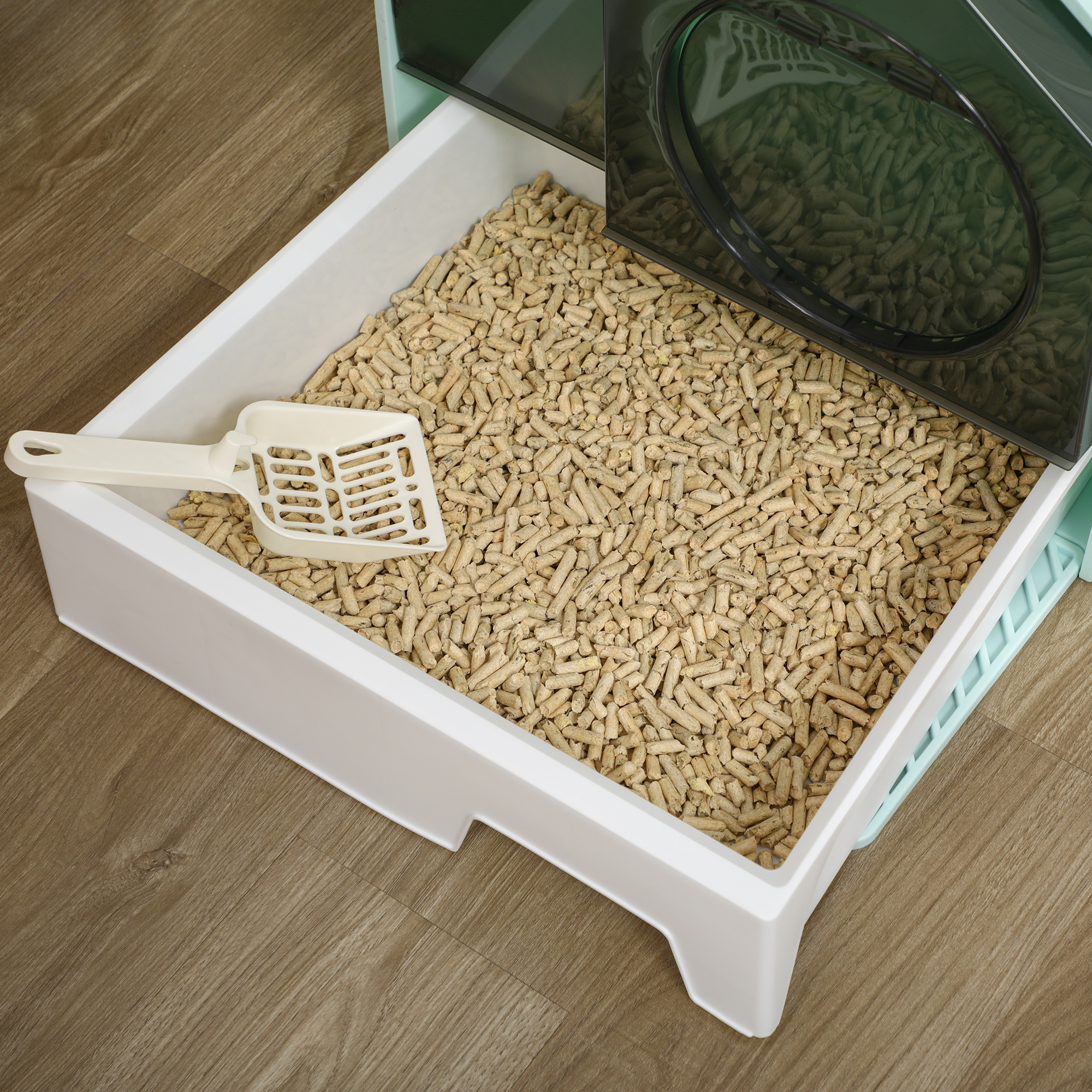 Arenero para gatos con pellets y pala.