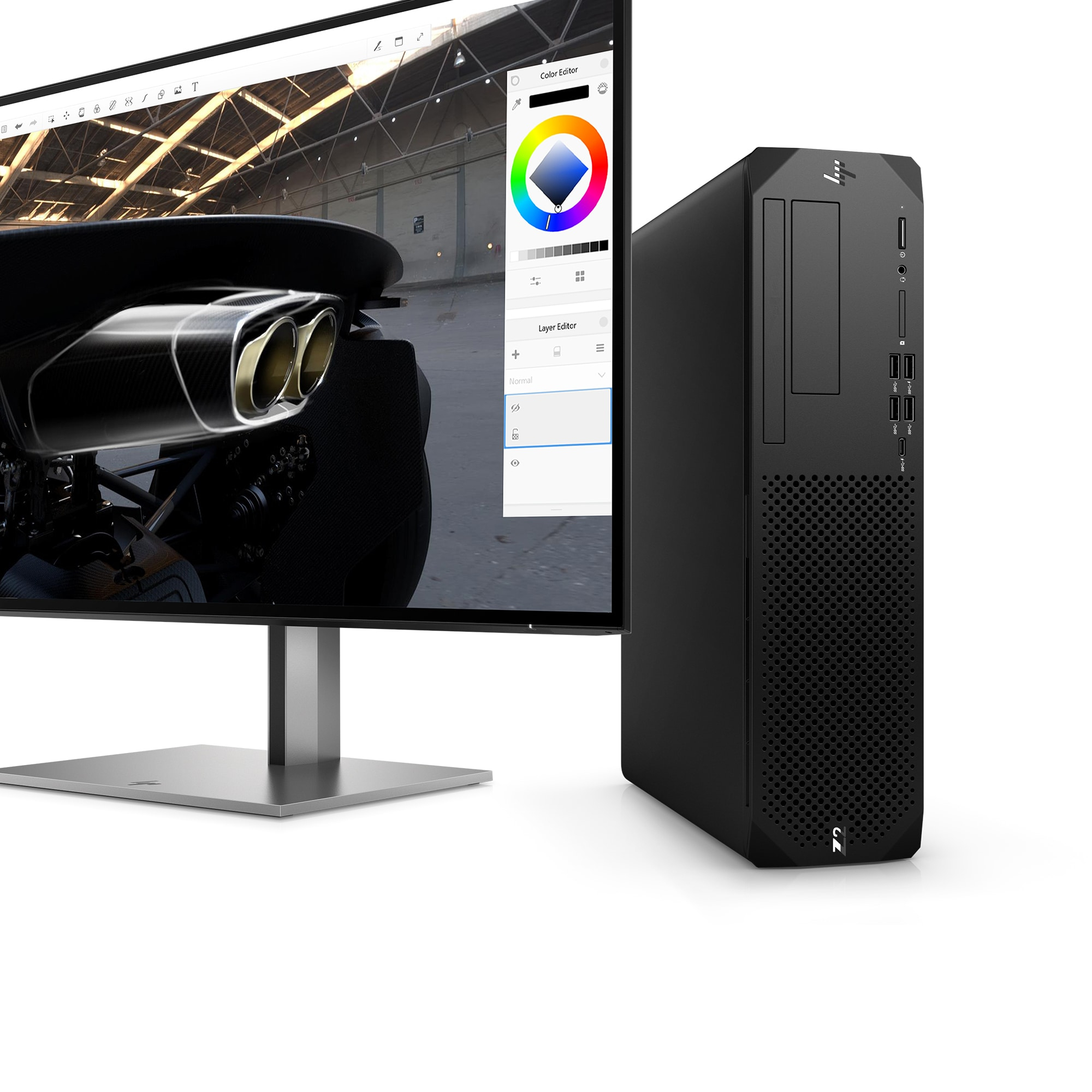 Computer e monitor neri. Il monitor mostra un editor di colori. Lo sfondo è bianco.