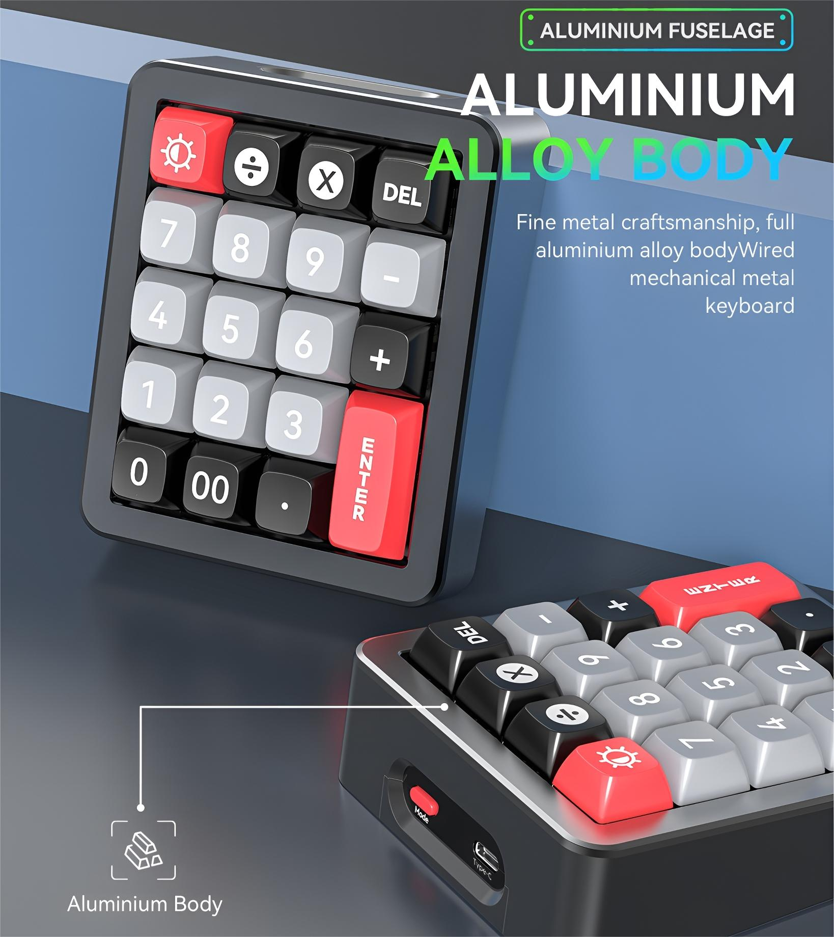 Schwarzer Rechner mit roten Tasten. Der Rechner hat ein Metallgehäuse und eine Tastatur.