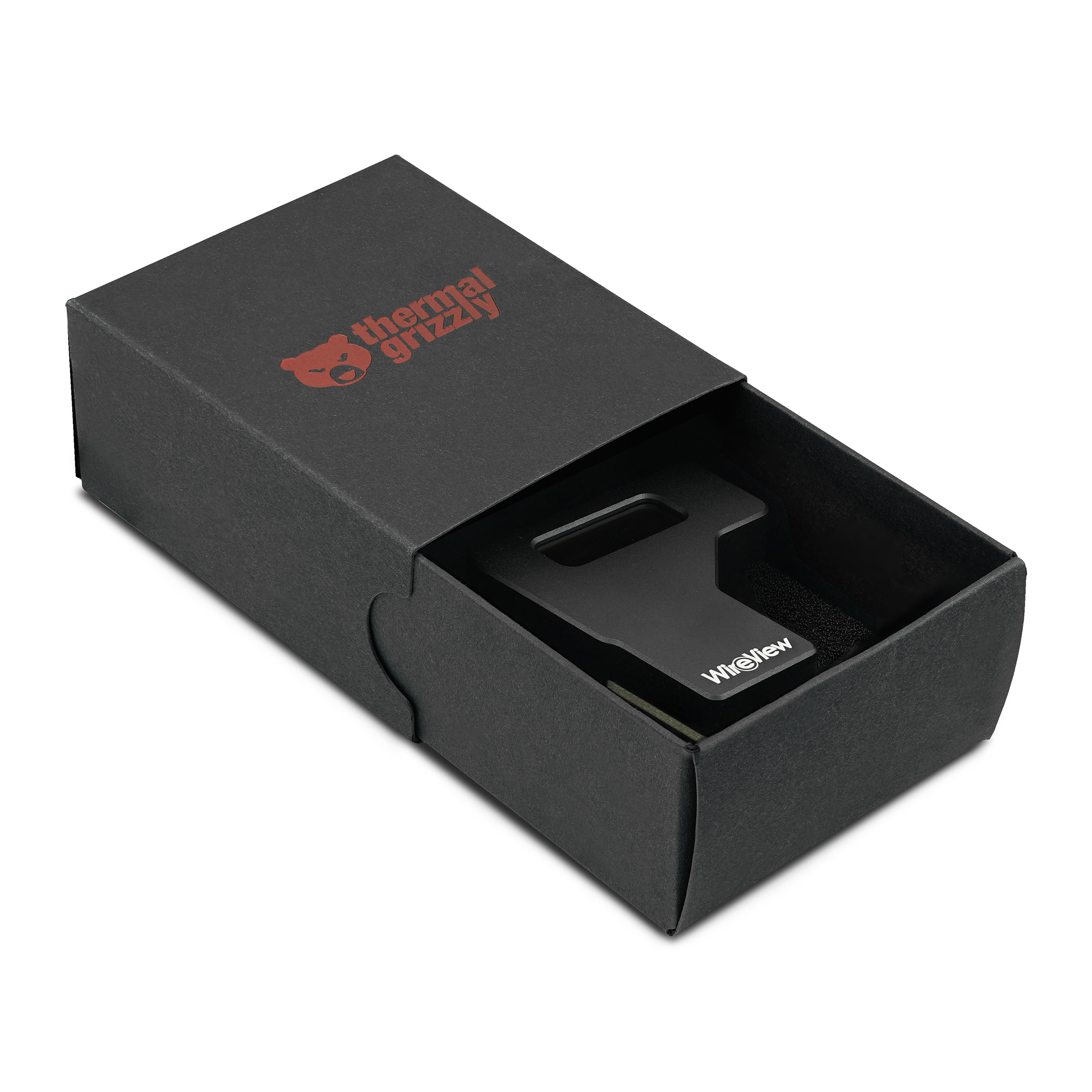 Scatola nera con logo Thermal Grizzly. All'interno un pezzo di metallo nero con la scritta 'WireView'.