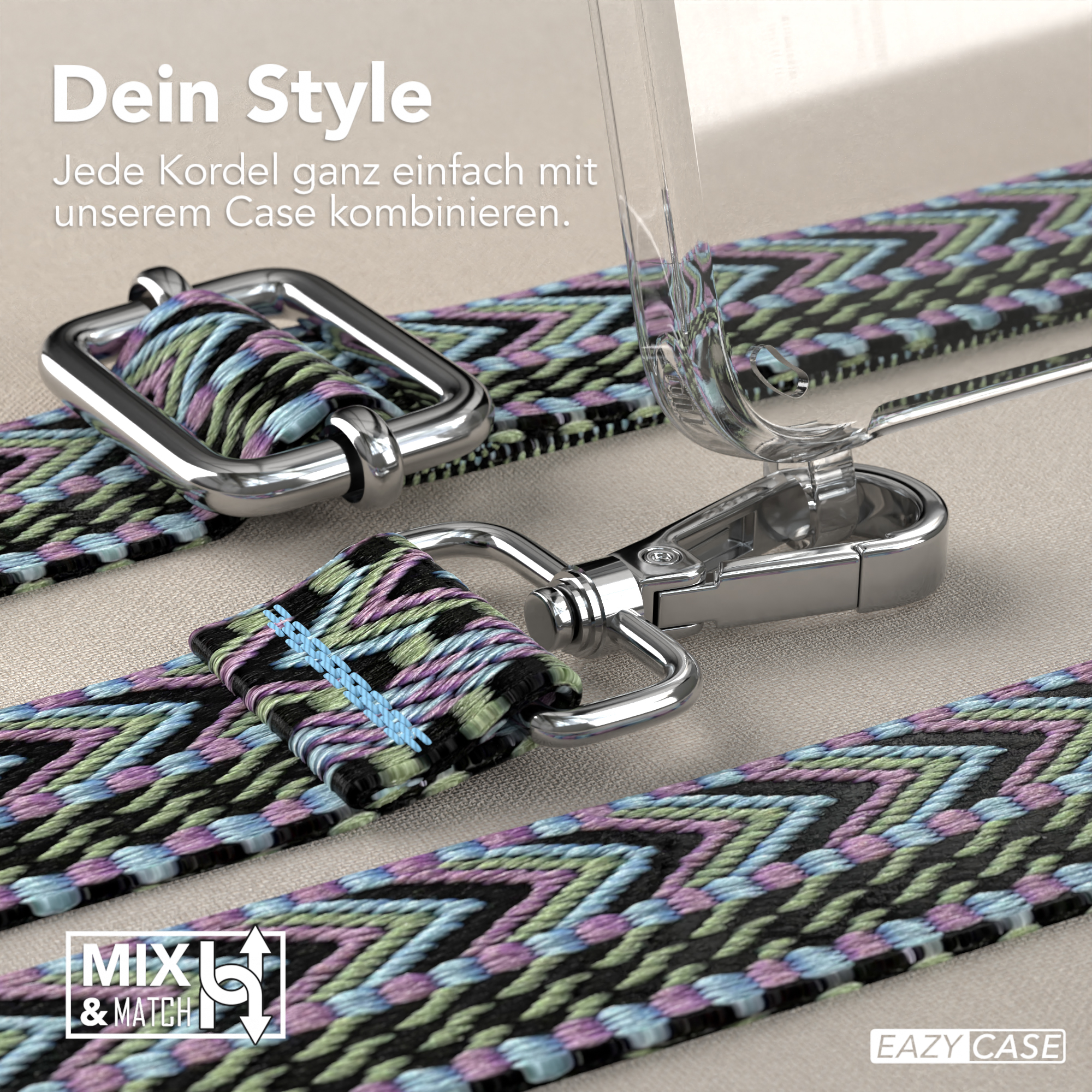 Nahaufnahme eines Handystraps mit buntem Webmuster und Metallverschlüssen. Hintergrund ist eine hellbraune Oberfläche.